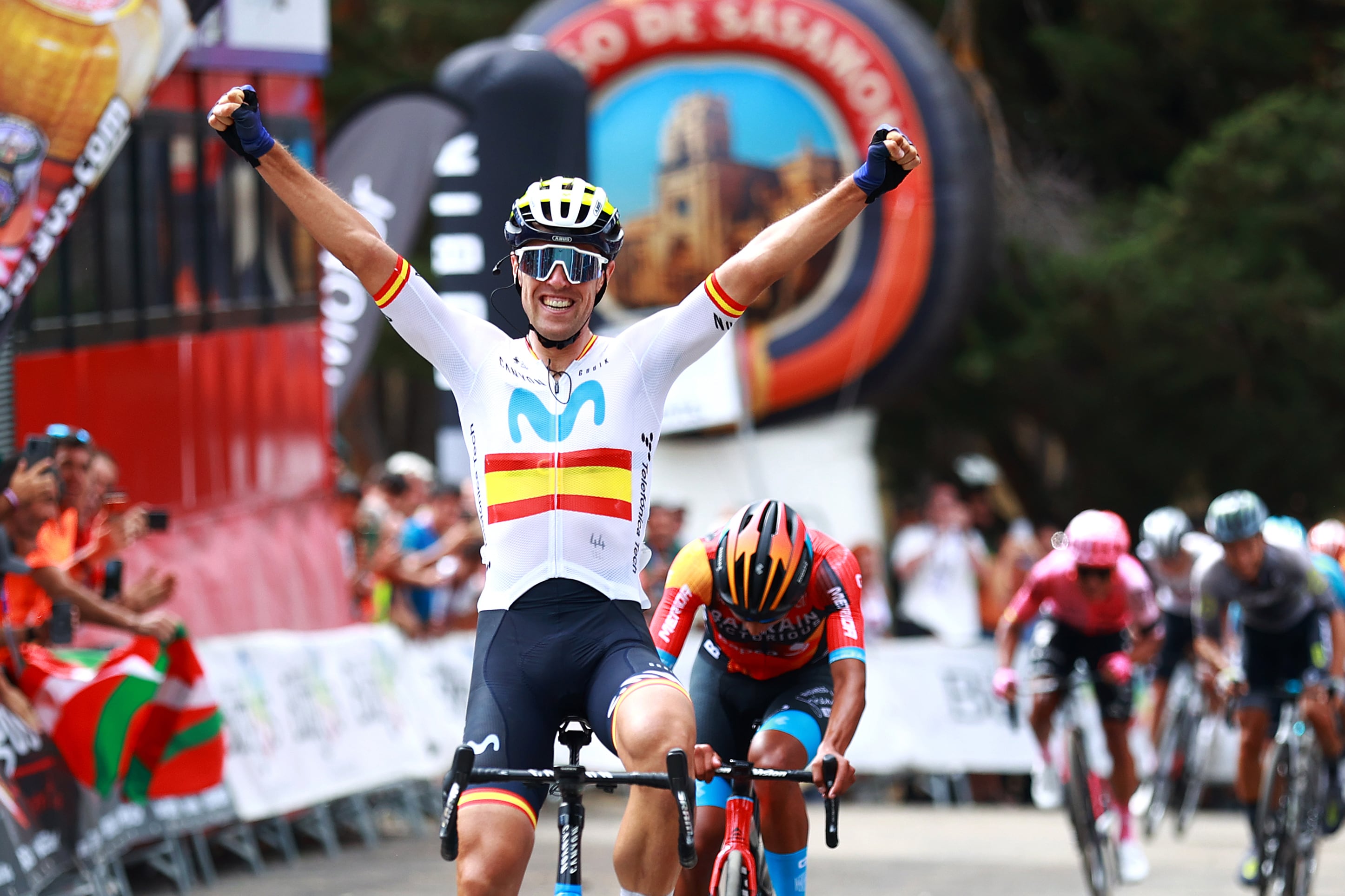 ACEBEL-VIZCARRA, SPAIN - AUGUST 18: (EDITOR'S NOTE: Alternate crop) Oier Lazkano Lopez of Spain and Movistar Team celebrates at finish line as stage winner ahead of Santiago Buitrago Sanchez of Colombia and Team Bahrain Victorious during the 45th Vuelta a Burgos 2023, Stage 4 a 157km stage from Santa Gadea del Cid to Pradoluengo (Acebel-Vizcarra) 1058m on August 18, 2023 in Acebel-Vizcarra, Spain. (Photo by Gonzalo Arroyo Moreno/Getty Images)