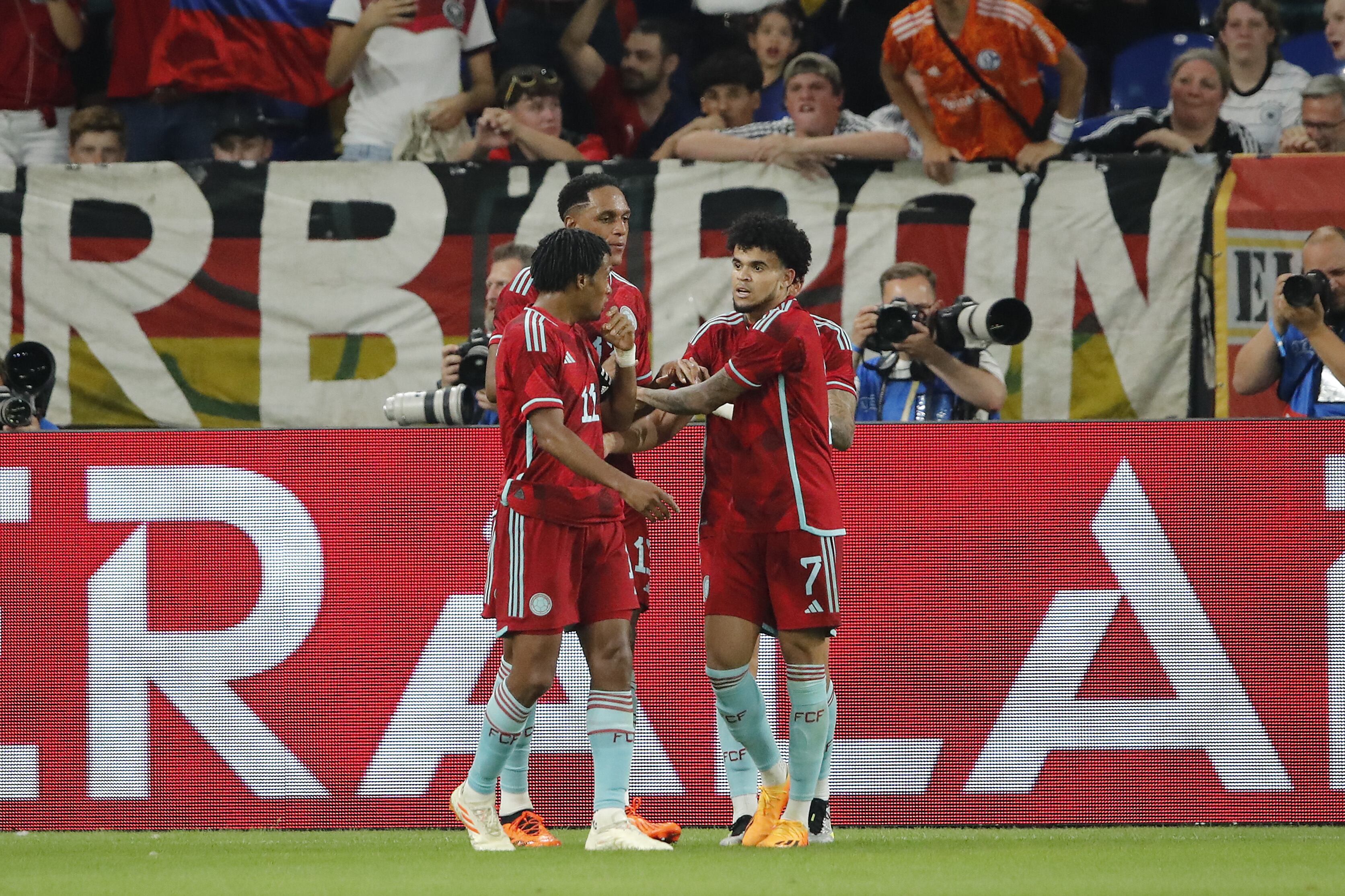 GELSENKIRCHEN - (LR) Juan Cuadrado of Colombia,Yerry Mina of Colombia, Luis Diaz of Colombia celebrate the 0-1 during the friendly Interland match between Germany and Colombia at the Veltins-Arena on June 20, 2023 in Gelsenkirchen, Germany. AP | Dutch Height | BART STOUTJESDYK (Photo by ANP via Getty Images)