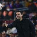 Barcelona's head coach Xavi Hernandez throws a ball during a Spanish La Liga soccer match between FC Barcelona and Cadiz at the Camp Nou stadium in Barcelona, Spain, Monday, April 18, 2022. (AP Photo/Joan Monfort)