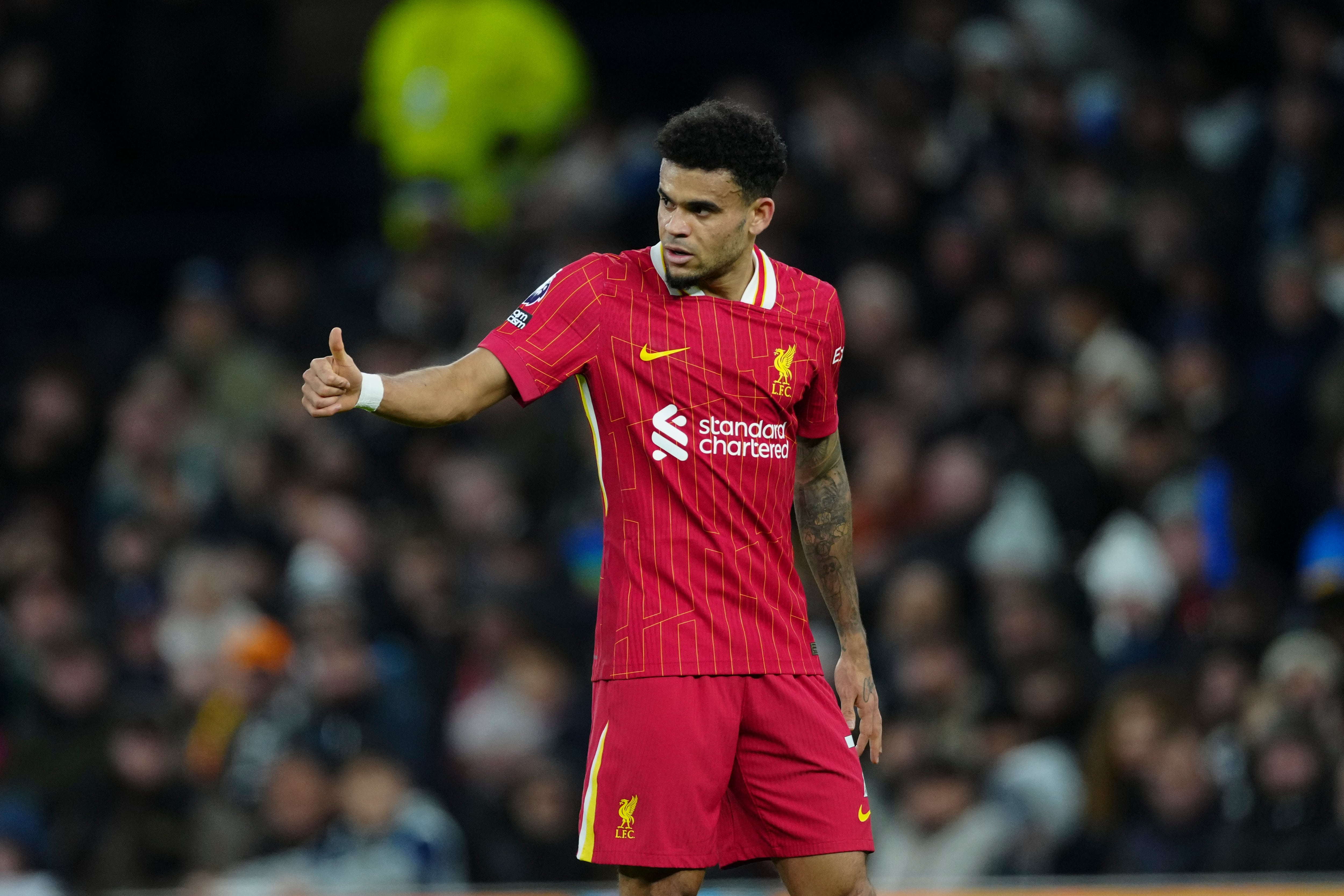 Liverpool's Luis Diaz gestures during the English Premier League soccer match between Tottenham and Liverpool at Tottenham Hotspur Stadium in London, Sunday, Dec. 22, 2024. (AP Photo/Dave Shopland)