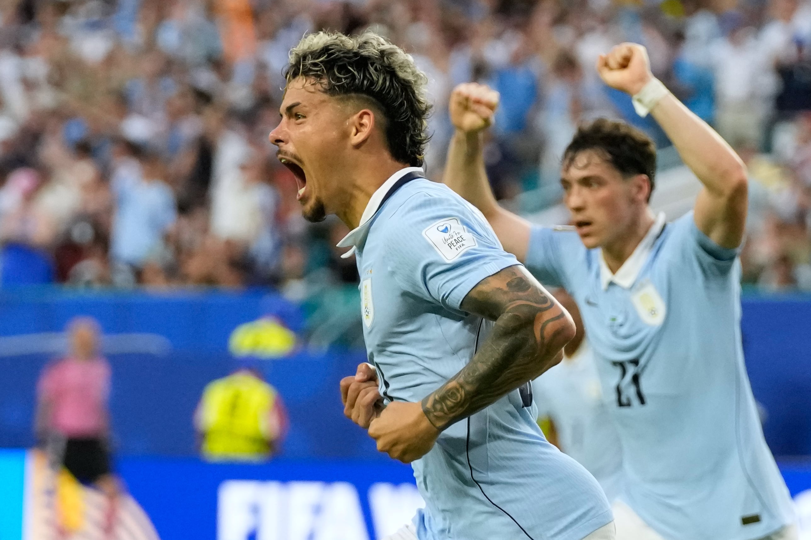 Uruguay's Maxi Araujo celebrates scoring his side's opening goal against Saudi Arabia during a World Cup Group H soccer match in Miami Gardens, Fla., Monday, June 15, 2026. (AP Photo/Lynne Sladky)