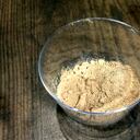 A dry mango powder - indian spice amchoor, isolated on wooden background