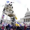 Trump supporters gather outside the Capitol, Wednesday, Jan. 6, 2021, in Washington. As Congress prepares to affirm President-elect Joe Biden's victory, thousands of people have gathered to show their support for President Donald Trump and his claims of election fraud. (AP Photo/John Minchillo)