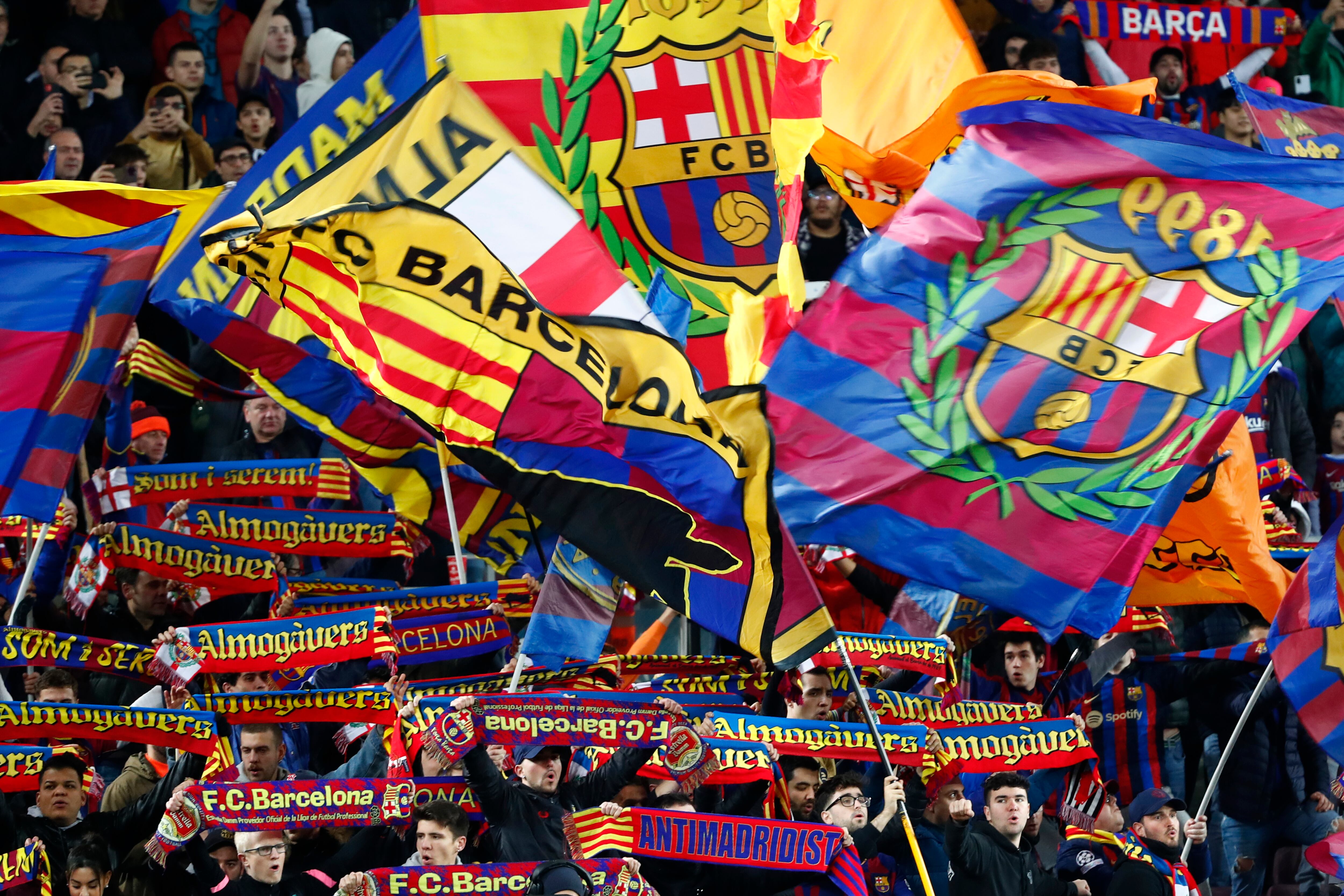 Barcelona fans cheer during a Spanish La Liga soccer match between Barcelona and Sevilla at the Camp Nou stadium in Barcelona, Spain, Sunday, Feb. 5, 2023. (AP Photo/Joan Monfort)