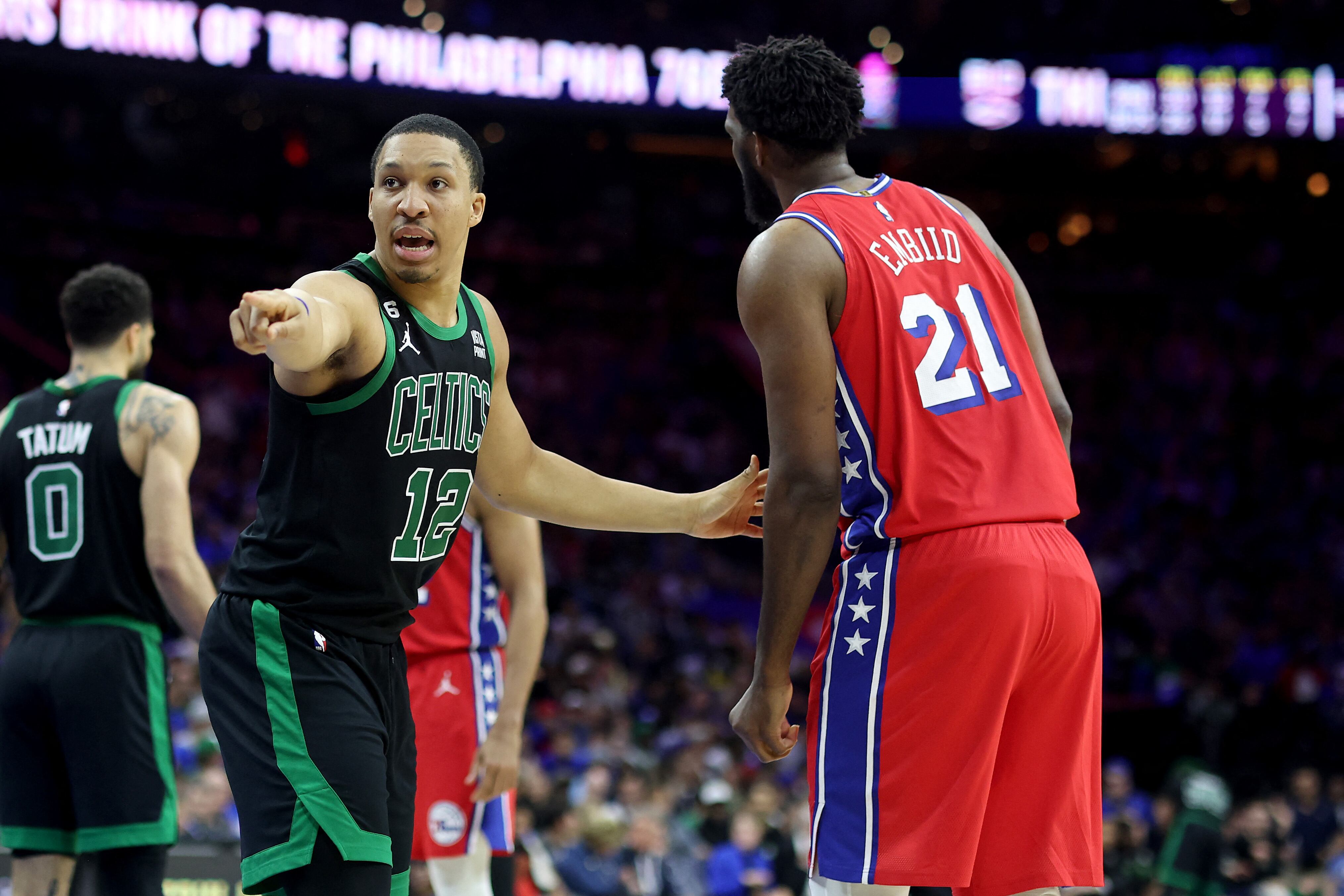 PHILADELPHIA, PENNSYLVANIA - MAY 05: Grant Williams #12 of the Boston Celtics points against Joel Embiid #21 of the Philadelphia 76ers during the third quarter in game three of the Eastern Conference Second Round Playoffs at Wells Fargo Center on May 05, 2023 in Philadelphia, Pennsylvania. NOTE TO USER: User expressly acknowledges and agrees that, by downloading and or using this photograph, User is consenting to the terms and conditions of the Getty Images License Agreement.   Tim Nwachukwu/Getty Images/AFP (Photo by Tim Nwachukwu / GETTY IMAGES NORTH AMERICA / Getty Images via AFP)