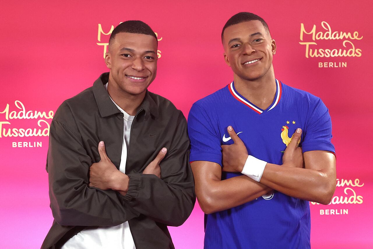 Paris Saint-Germain's French forward #07 Kylian Mbappe poses as he unveils his one-of-a-kind wax figure in Paris on May 16, 2024. Mbappe's one-of-a-kind wax figure will be taken to Berlin to be exhibited at Madame Tussauds in Berlin. (Photo by FRANCK FIFE / AFP)