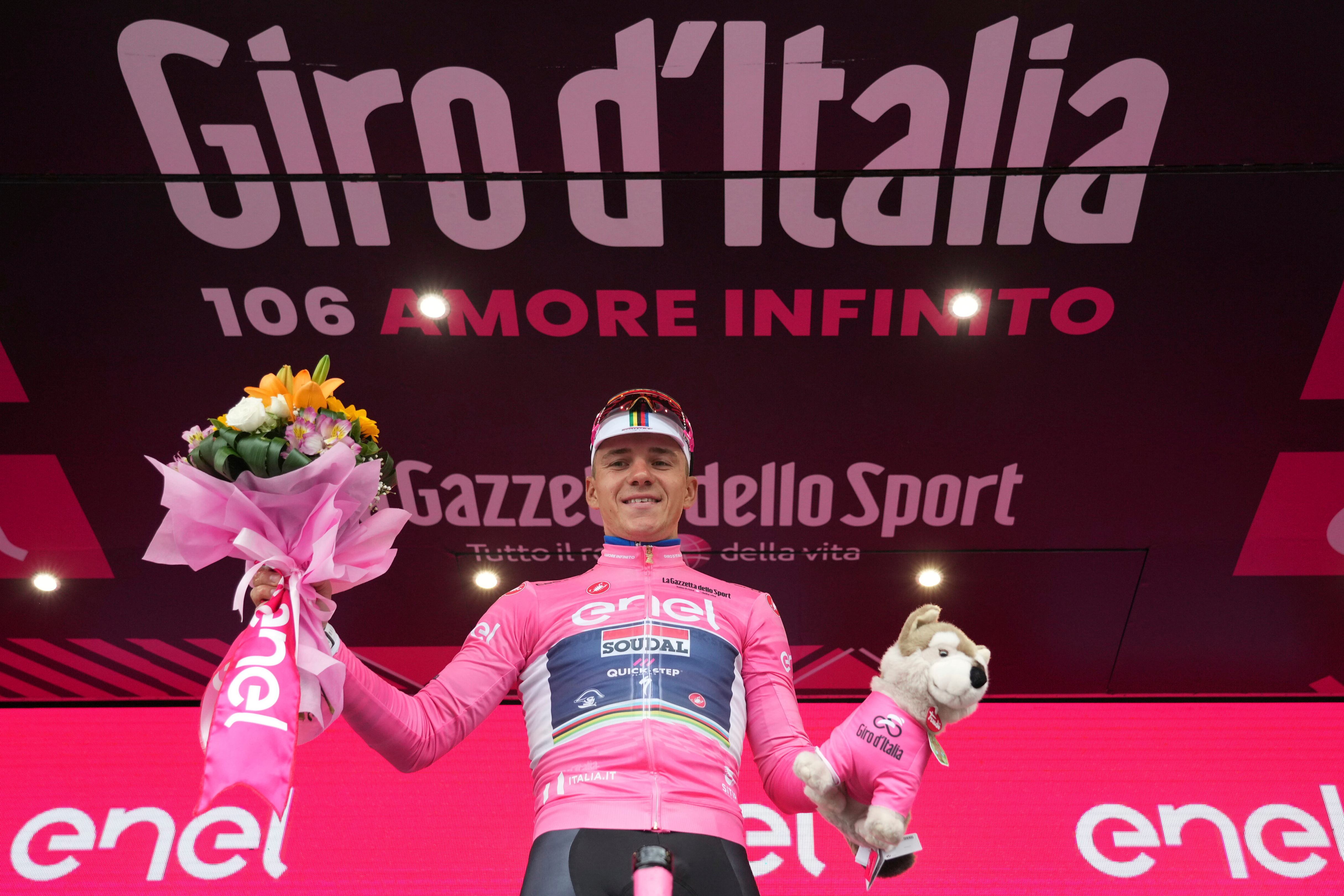 Belgium's Remco Evenepoel celebrates maintaining the pink jersey of the overall leader after the third stage of the Giro d'Italia cycling race from Vasto to Melfi, Italy, Monday, May 8, 2023. (AP/Gian Mattia D'Alberto/LaPresse)