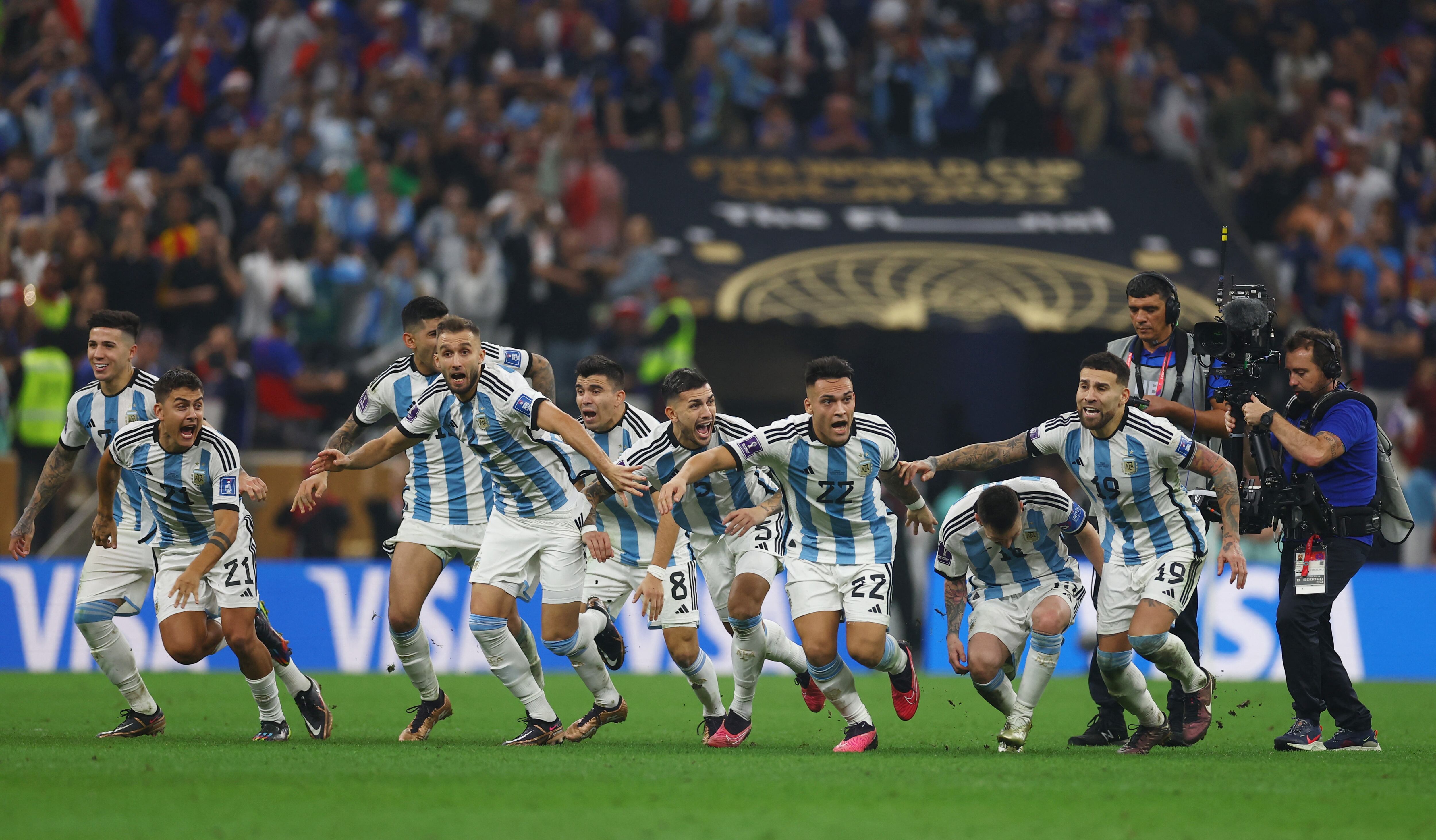 Soccer Football - FIFA World Cup Qatar 2022 - Final - Argentina v France - Lusail Stadium, Lusail, Qatar - December 18, 2022 Argentina's Lionel Messi celebrates alongside Nicolas Otamendi, Lautaro Martinez and teammates after winning the World Cup REUTERS/Kai Pfaffenbach