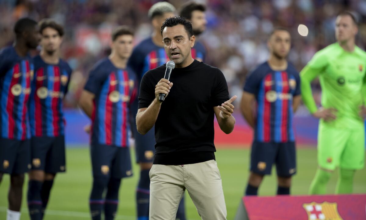 Barcelona's coach Xavi Hernandez addresses to the crowd prior of the Joan Gamper trophy soccer match between FC Barcelona and Pumas Unam at the Camp Nou Stadium in Barcelona, Spain, Sunday, Aug. 7, 2022. (AP/Joan Monfort)