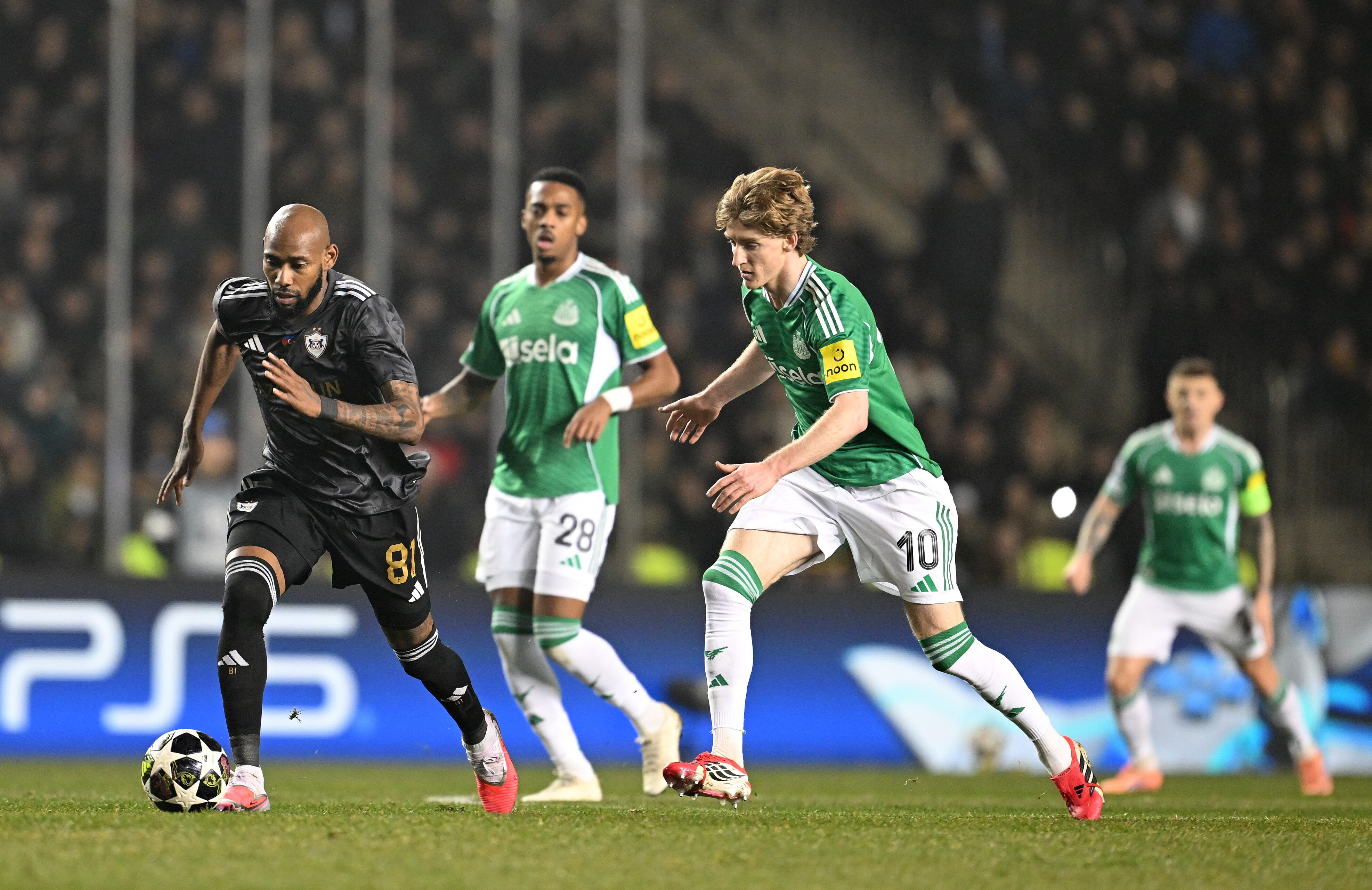 BAKU, AZERBAIJAN - FEBRUARY 18: Kevin Medina of Qarabag runs ahead of Anthony Gordon of Newcastle United during the UEFA Champions League 2025/26 League Knockout Play-off First Leg match between Qarabag FK and Newcastle United FC at Tofiq Bahramov Stadium on February 18, 2026 in Baku, Azerbaijan. (Photo by Christian Kaspar-Bartke - UEFA/UEFA via Getty Images)