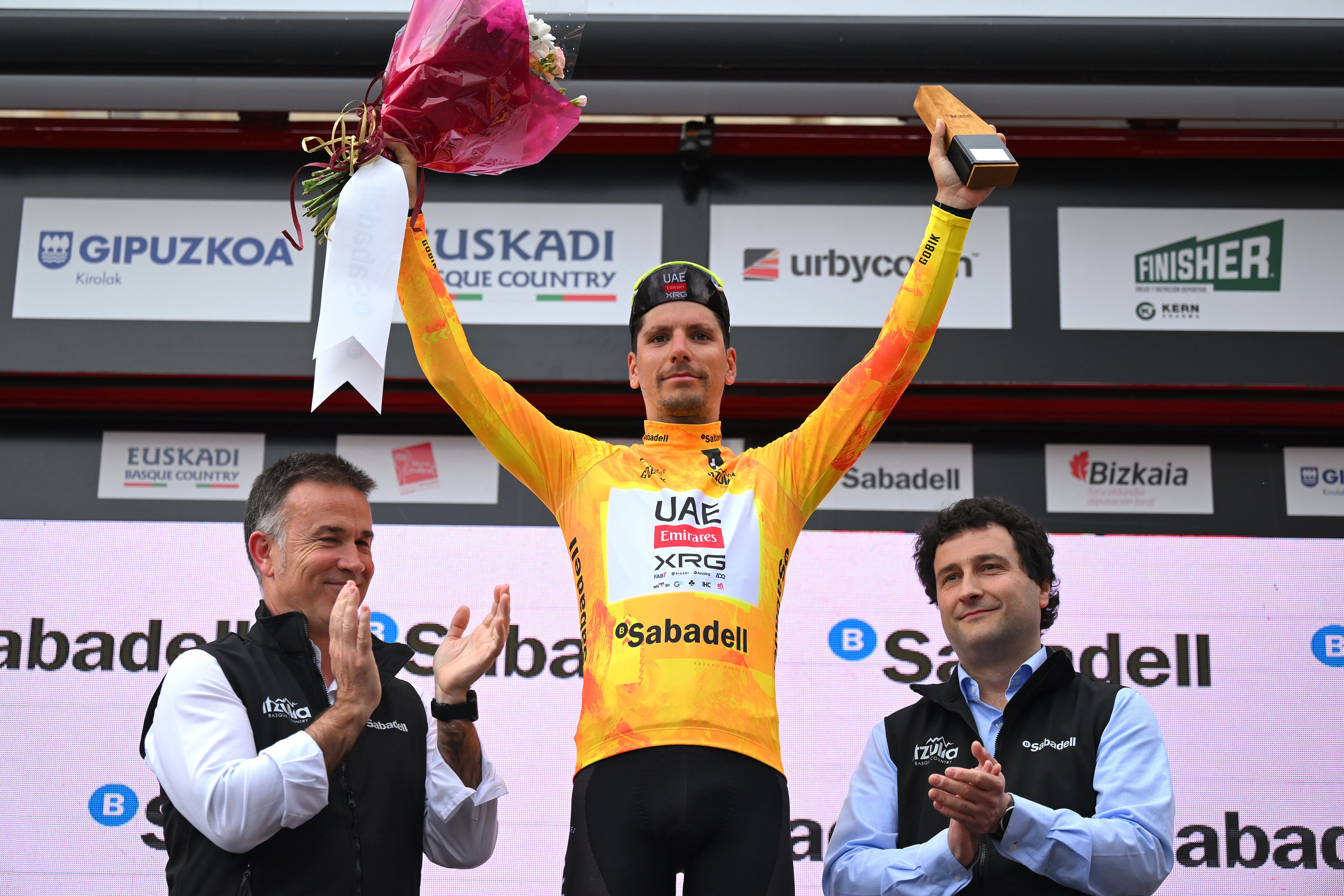 URDUNA, SPAIN - APRIL 11: Joao Almeida of Portugal and UAE Team Emirates - XRG - Yellow Leader Jersey celebrates at podium during the 64th Itzulia Basque Country 2025, Stage 5 a 172.3km stage from Urduna to Urduna / #UCIWT / on April 11, 2025 in Urduna, Spain. (Photo by Tim de Waele/Getty Images)