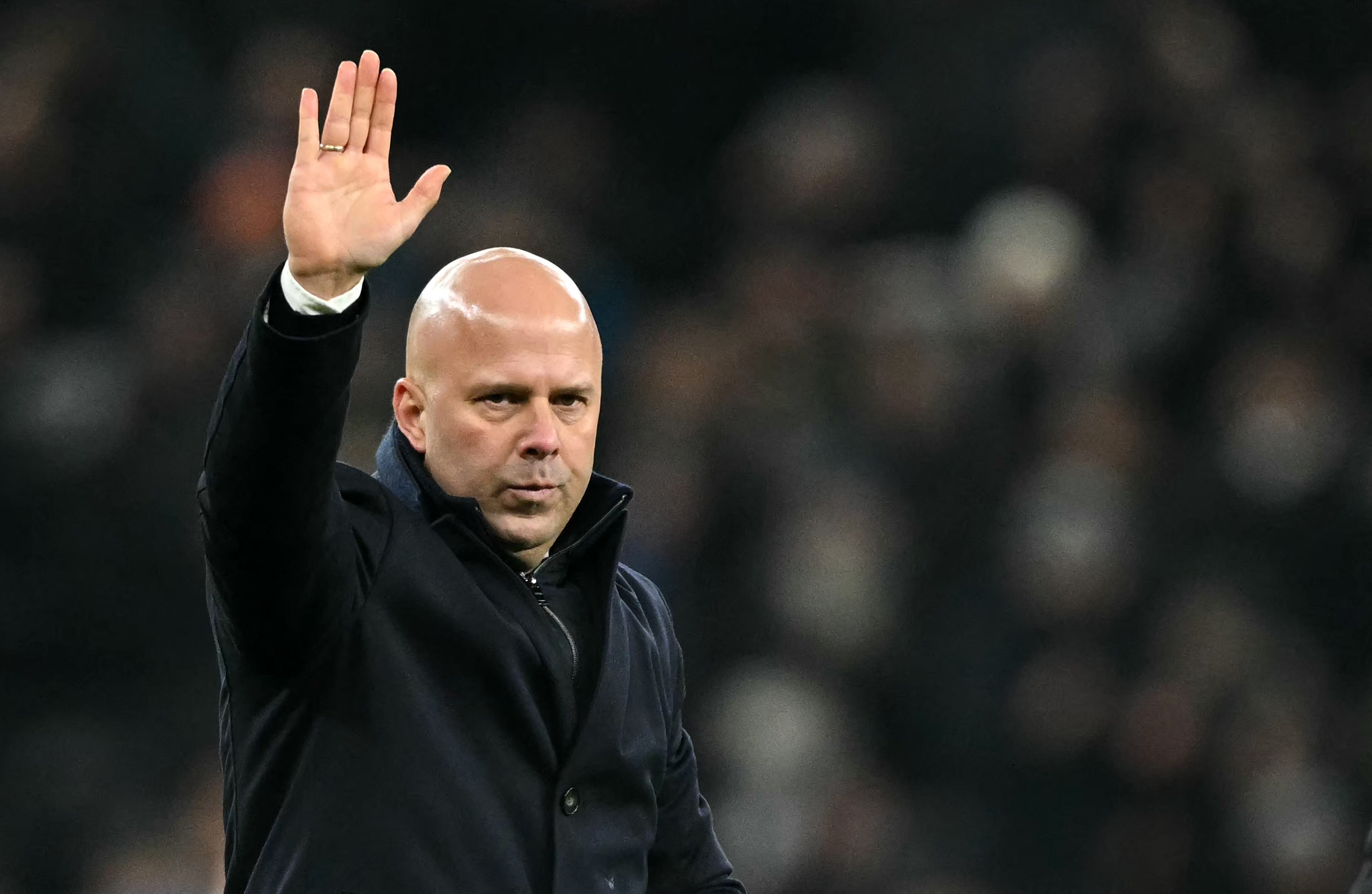 Liverpool's Dutch manager Arne Slot waves to the fans after the English League Cup semi-final first leg football match between Tottenham Hotspur and Liverpool at the Tottenham Hotspur Stadium in London, on January 8, 2025. Tottenham won the match 1-0. (Photo by JUSTIN TALLIS / AFP) / RESTRICTED TO EDITORIAL USE. No use with unauthorized audio, video, data, fixture lists, club/league logos or 'live' services. Online in-match use limited to 120 images. An additional 40 images may be used in extra time. No video emulation. Social media in-match use limited to 120 images. An additional 40 images may be used in extra time. No use in betting publications, games or single club/league/player publications. /