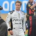 Actor Brad Pitt walks through the paddock before before the British Formula One Grand Prix race at the Silverstone racetrack, Silverstone, England, Sunday, July 9, 2023. Production of Brad Pitt and Lewis Hamilton's F1 movie has begun at Silverstone. (Christian Bruna/Pool photo via AP)