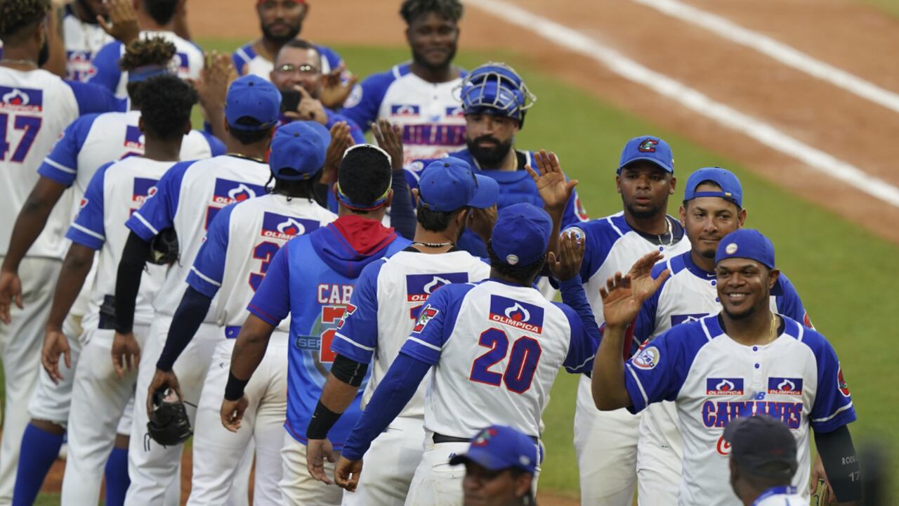 Players of Colombia celebrate after their 8-1 victory over Venezuela during a Caribbean Series baseball semifinal game in Santo Domingo, Dominican Republic, Wednesday, Feb. 2, 2022. (AP/Fernando Llano)