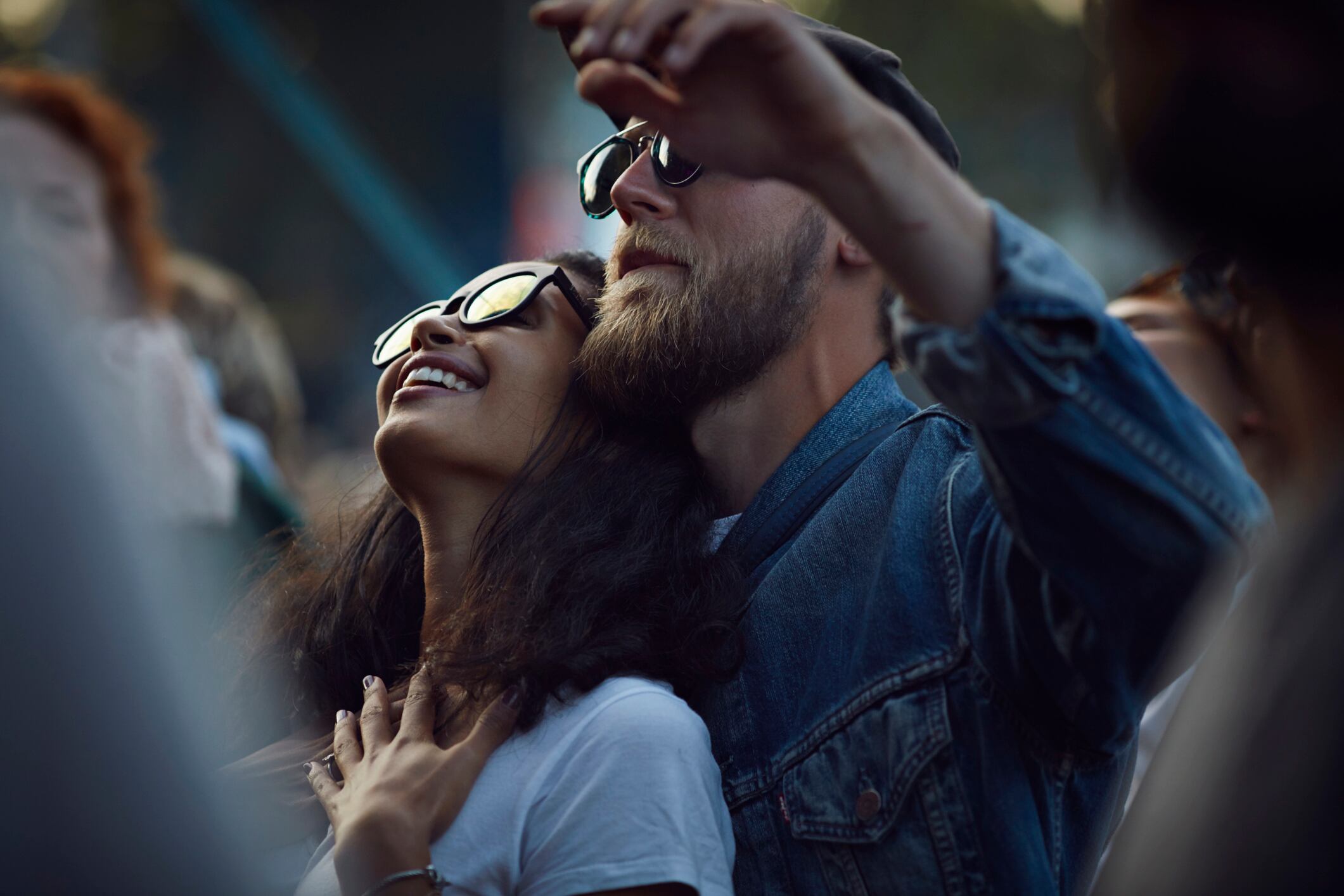 Friends hanging out at big music festival