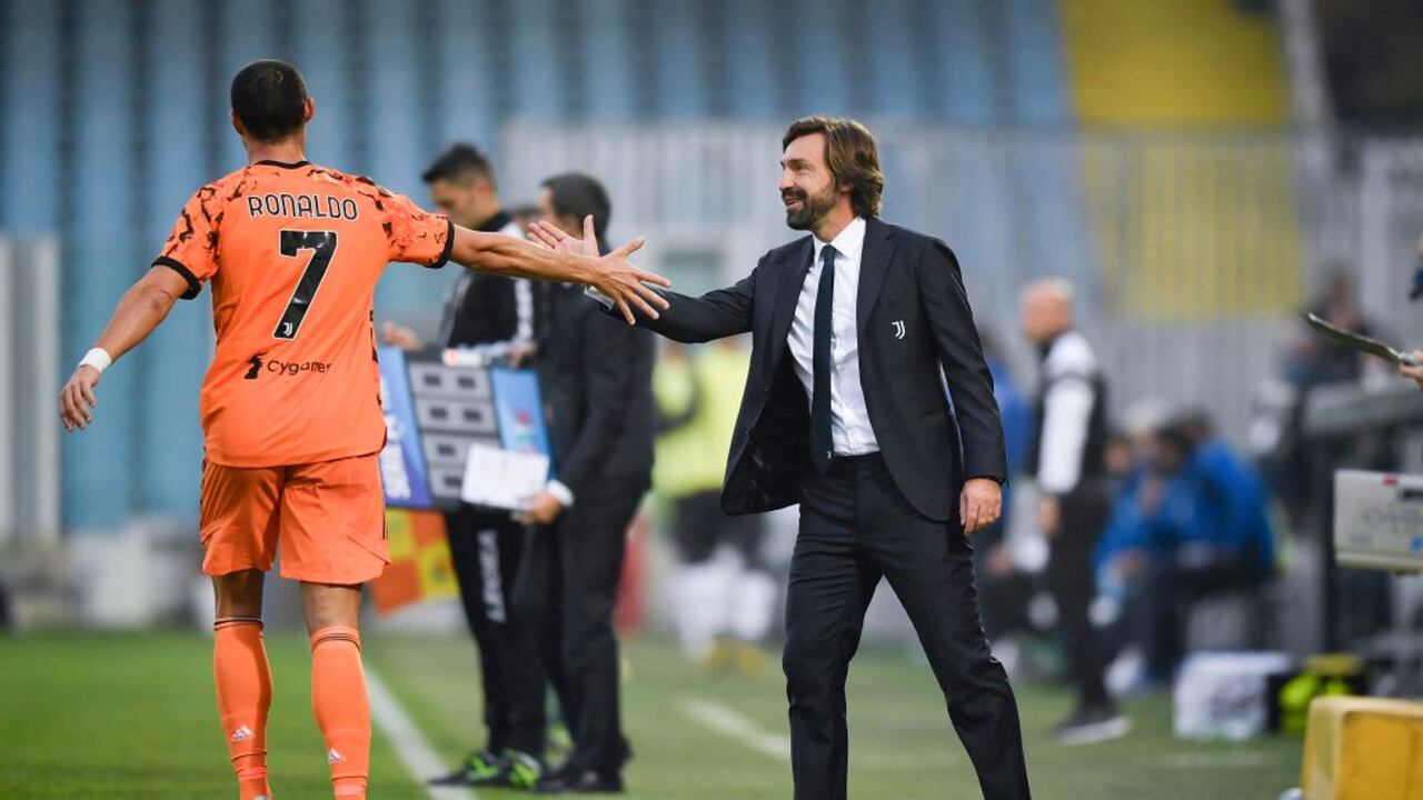 Andrea Pirlo, exjugador y técnico italiano junto a Cristiano Ronaldo.
