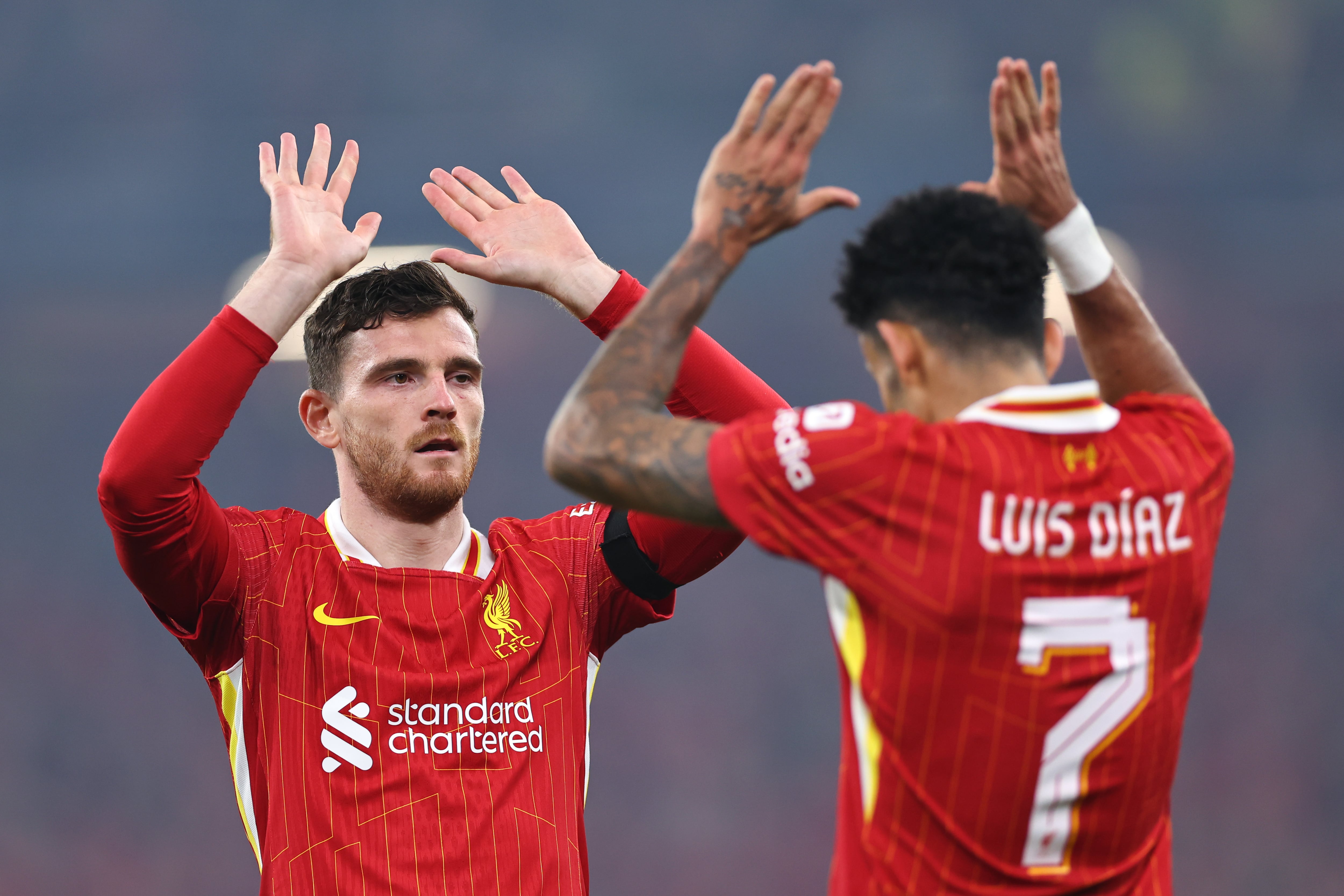 LIVERPOOL, ENGLAND - NOVEMBER 5: Andrew Robertson celebrates with Luis Diaz of Liverpool after he scores a goal to make it 3-0 during the UEFA Champions League 2024/25 League Phase MD4 match between Liverpool FC and Bayer 04 Leverkusen at Anfield on November 5, 2024 in Liverpool, England. (Photo by Robbie Jay Barratt - AMA/Getty Images)