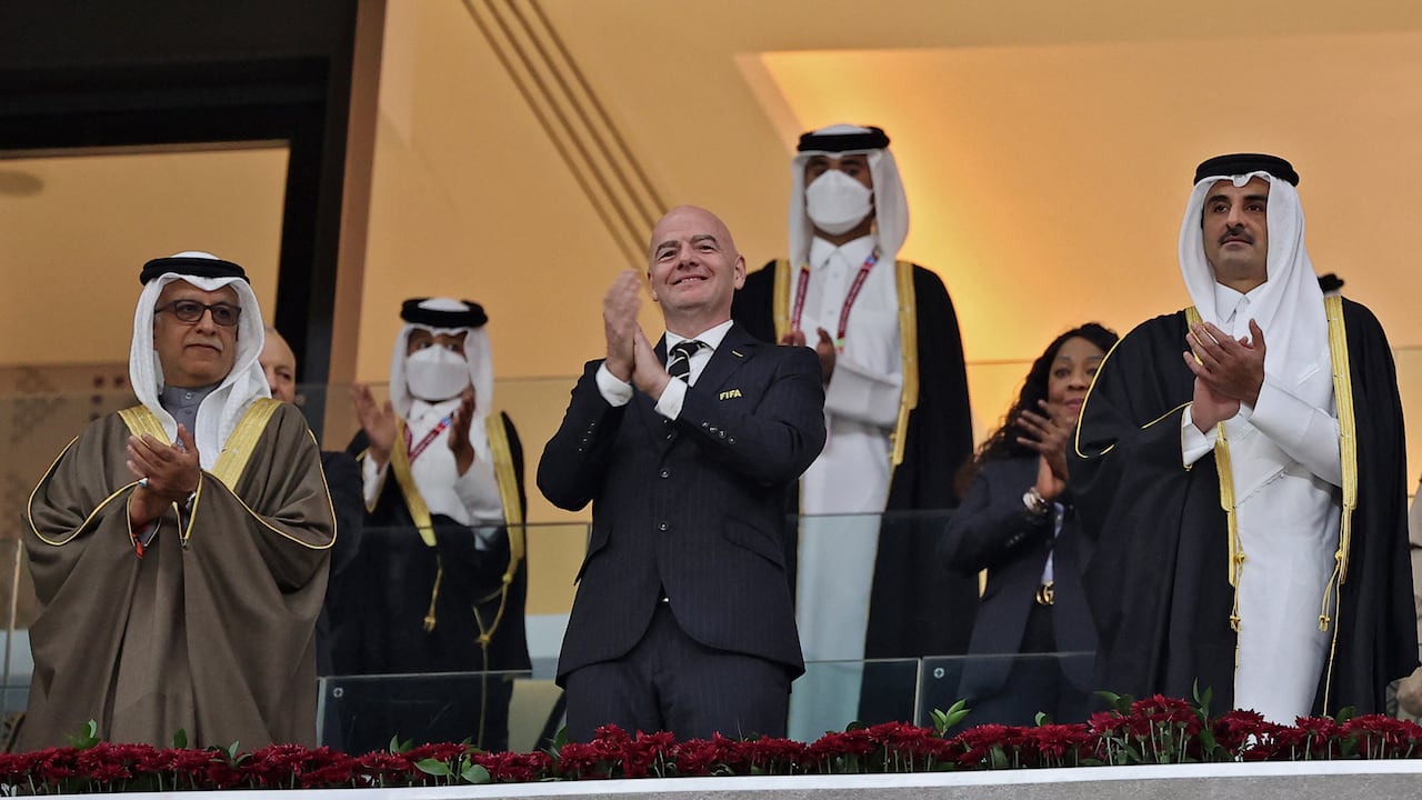 Asian Football Confederation (AFC) president Salman Bin Ibrahim Al-Khalifa (L), FIFA President Gianni Infantino (C) and Qatar's Emir Sheikh Tamim bin Hamad al-Thani attend the FIFA Arab Cup 2021 final football match between Tunisia and Algeria at the Al-Bayt stadium in the Qatari city of Al-Khor on December 18, 2021. (Photo by KARIM JAAFAR / AFP)