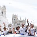 Real Madrid's Spanish forward #14 Joselu and teammates parade onboard a bus as they celebrate their 36th La Liga trophy at the Cibeles square in Madrid on May 12, 2024. Real Madrid's fans line the streets of Madrid as 'Los blancos' celebrate their 36th Liga trophy before facing Borussia Dortmund at Wembley in the Champions League final on June 1. (Photo by OSCAR DEL POZO / AFP)
