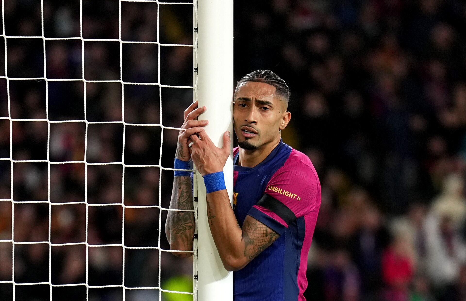 BARCELONA, SPAIN - MARCH 11: Raphinha of FC Barcelona reacts, after missing a chance during the UEFA Champions League 2024/25 UEFA Champions League 2024/25 Round of 16 Second Leg match between FC Barcelona and SL Benfica at Estadi Olímpic Lluís Companys on March 11, 2025 in Barcelona, Spain. (Photo by Aitor Alcalde/Getty Images)