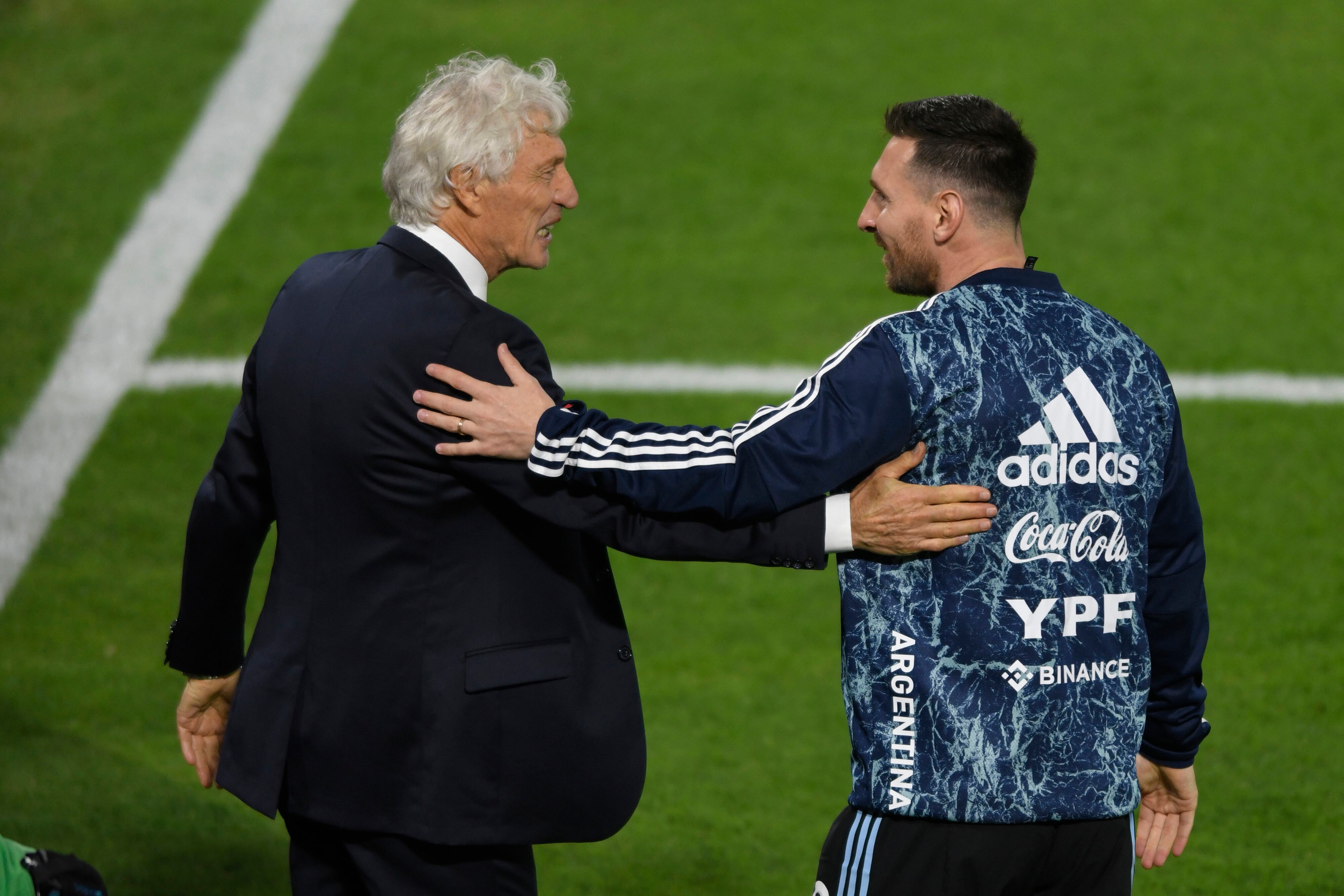 BUENOS AIRES, ARGENTINA - MARCH 25: Jose Pekerman coach of Venezuela and Lionel Messi of Argentina greet prior to the FIFA World Cup Qatar 2022 qualification match between Argentina and Venezuela at Estadio Alberto J. Armando on March 25, 2022 in Buenos Aires, Argentina. (Photo by Gustavo Garello/Jam Media/Getty Images)