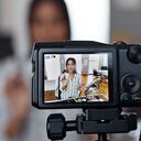 Vlogger making making video at home in stylish urban apartment