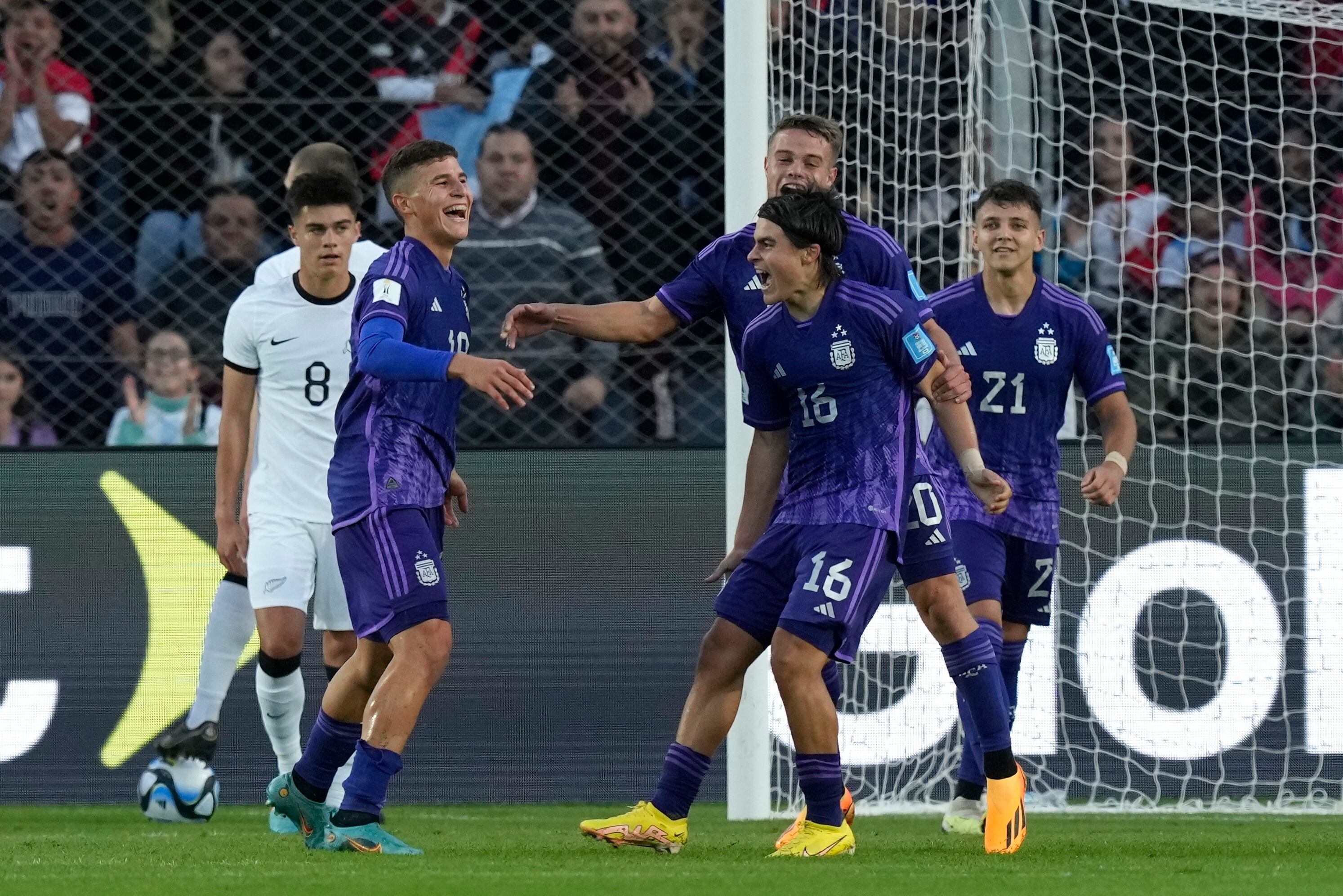 Argentina's Gino Infantino, second from the left, celebrates with his teammates after scoring his side's second goal against New Zealand during a FIFA U-20 World Cup Group A soccer match at the San Juan stadium in San Juan, Argentina, Friday, May 26, 2023. (AP Photo/Natacha Pisarenko)