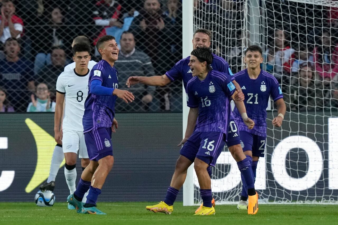 Argentina's Gino Infantino, second from the left, celebrates with his teammates after scoring his side's second goal against New Zealand during a FIFA U-20 World Cup Group A soccer match at the San Juan stadium in San Juan, Argentina, Friday, May 26, 2023. (AP Photo/Natacha Pisarenko)