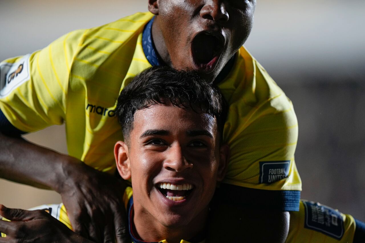 Ecuador's Kendry Paez, bottom, celebrates after scoring the opening goal against Bolivia during a qualifying soccer match for the FIFA World Cup 2026 at Hernando Siles stadium in La Paz, Bolivia, Thursday, Oct. 12, 2023.(AP Photo/Juan Karita)