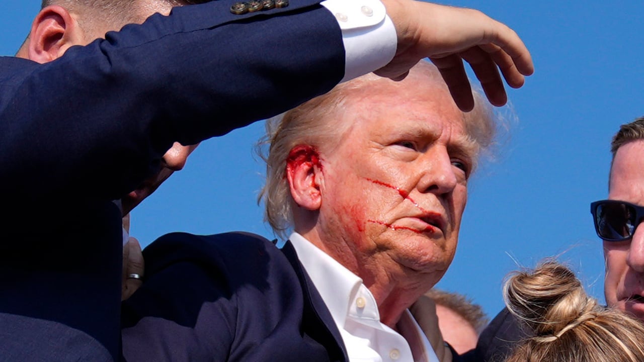 Republican presidential candidate former President Donald Trump is surround by U.S. Secret Service agents at a campaign rally, Saturday, July 13, 2024, in Butler, Pa. (AP Photo/Evan Vucci)