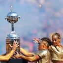 GUAYAQUIL, ECUADOR - OCTOBER 29: Performers hold the trophy during the pre.match show prior to the final of Copa CONMEBOL Libertadores 2022 between Flamengo and Athletico Paranaense at Estadio Monumental Isidro Romero Carbo on October 29, 2022 in Guayaquil, Ecuador. (Photo by Hector Vivas/Getty Images)