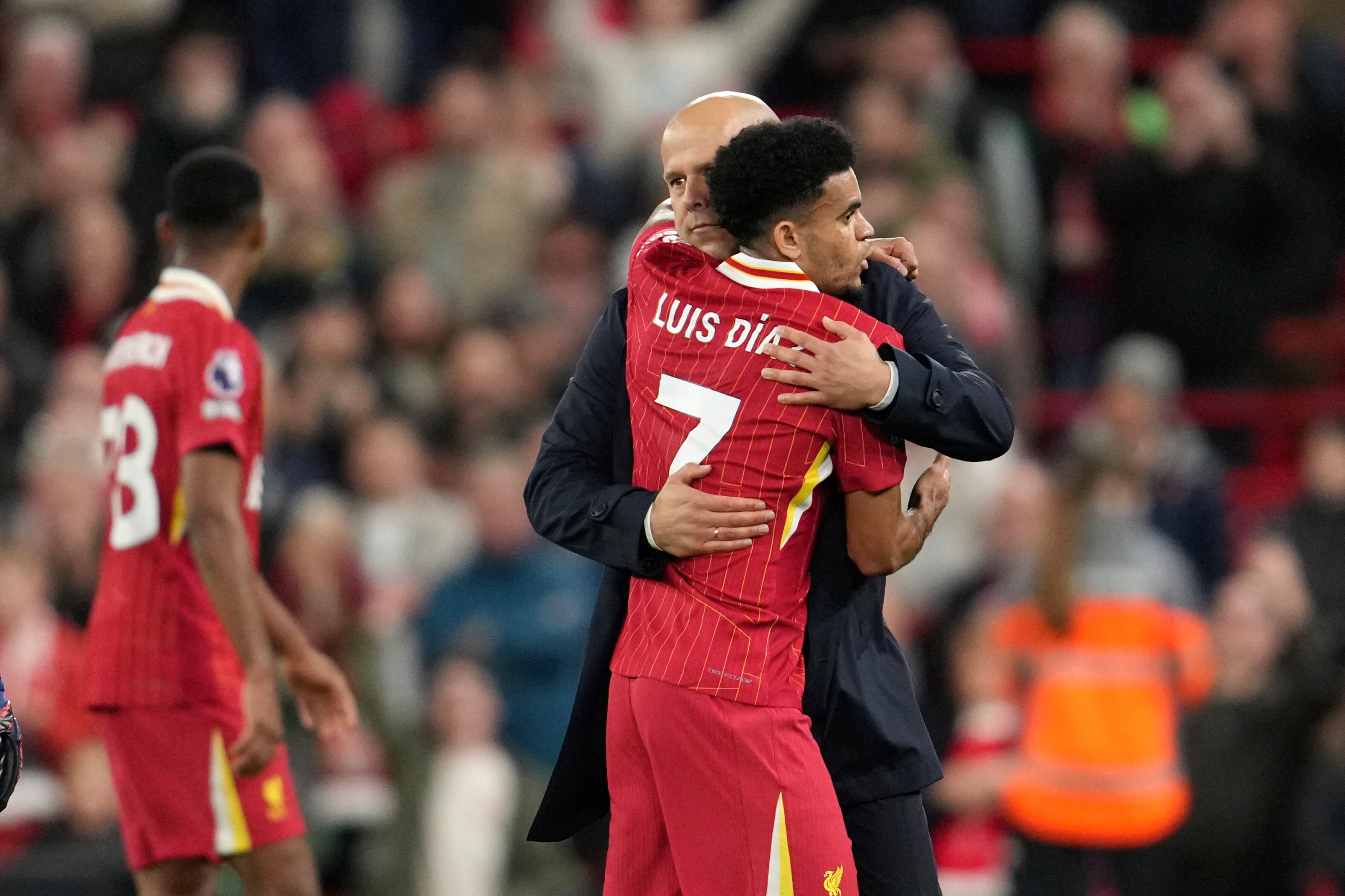 Liverpool's manager Arne Slot, right, celebrates with his player Luis Diaz after winning the English Premier League soccer match between Liverpool and Brighton at the Anfield stadium in Liverpool, England, Saturday, Nov. 2, 2024. Liverpool won 2-1.(AP Photo/Jon Super)