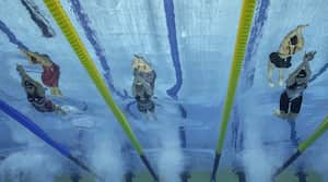 USA's Alex Walsh (L) competes with USA's Leah Hayes (C) and Canada's Mary-Sophie Harvey in the women's 200m medley finals during the Budapest 2022 World Aquatics Championships at Duna Arena in Budapest on June 19, 2022. (Photo by Oli SCARFF / AFP)