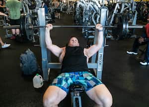 CALIFORNIA, UNITED STATES - FEBRUARY 25, 2020 - A FORMERLY obese man weighing over 400lbs has lost half his body weight - and now runs half marathons and competes in bodybuilding. At his heaviest Jordan Grahm, from LA, California, weighed in at 421lbs. Doctors told Jordan he was eating himself to death but he ignored the warnings, depressed and determined to keep eating, because of a tragedy early on in his life. Overweight since he was a little boy, by the time he was 13, Jordan estimates he was 100lbs bigger than everyone else his age. His mother would encourage Jordan to lose weight but she unexpectedly died in her sleep when Jordan was just 14. Angry with the injustice of his mother's passing, Jordan's depression propelled him to drugs, alcohol and food to numb his pain. He would go to the drive thru at least twice a day and consume 10,000 calories a day. If it hadn't been for a major car crash at 3am one March morning, Jordan might have not been alive today. It was the wakeup call he needed to realise his life was worth living. The next day Jordan woke up and started walking his dog Blackberry in the neighbourhood and began making switches to his diet. In a year he lost 100lbs. At his lowest, Jordan weighed 209lbs - losing half of his body weight. Aside from his incredible health gains, Jordan's daily fitness walks also helped him find love. Neighbour Kelli had noticed Jordan and Blackberry on their daily walks and asked Jordan on a double date. They quickly became inseparable and when Jordan had excess skin removal surgery, Kelli was right on hand. The couple recently wed- with both dogs part of the ceremony - and are now looking forward to the next stage of their life: first up running a half marathon together. PHOTOGRAPH BY Joe Roberts / Barcroft Studios / Future Publishing - NOTE: This Photo Can Only Be Used Within Context With The Information Provided In The Metadata (Photo credit should read Joe Roberts/Barcroft Media via Getty Images)