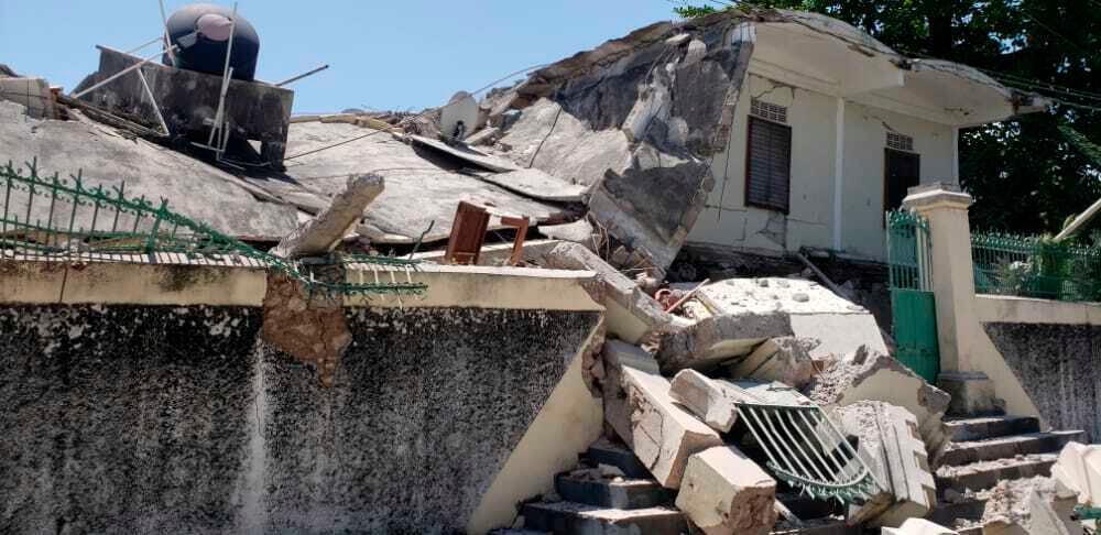 The residence of the Catholic bishop is damaged after an earthquake in Les Cayes, Haiti, Saturday, Aug. 14, 2021. (AP Photo/Delot Jean)