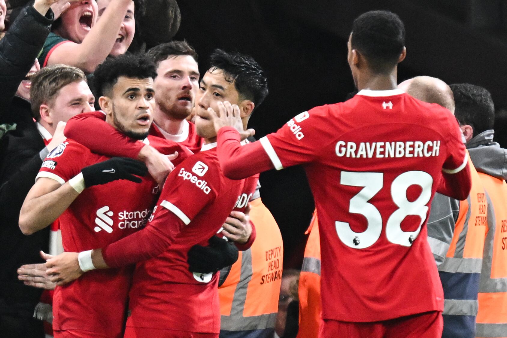 Liverpool's Colombian midfielder #07 Luis Diaz (L) celebrates after scoring his team third goal during the English Premier League football match between Liverpool and Luton Town at Anfield in Liverpool, north west England on February 21, 2024. (Photo by Paul ELLIS / AFP) / RESTRICTED TO EDITORIAL USE. No use with unauthorized audio, video, data, fixture lists, club/league logos or 'live' services. Online in-match use limited to 120 images. An additional 40 images may be used in extra time. No video emulation. Social media in-match use limited to 120 images. An additional 40 images may be used in extra time. No use in betting publications, games or single club/league/player publications. /