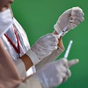 Health workers prepare to administer the Sinovac Covid-19 coronavirus vaccine in Banda Aceh on April 20, 2021. (Photo by CHAIDEER MAHYUDDIN / AFP)