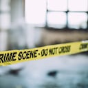 Detectives and forensics on murder crime scene collecting evidence