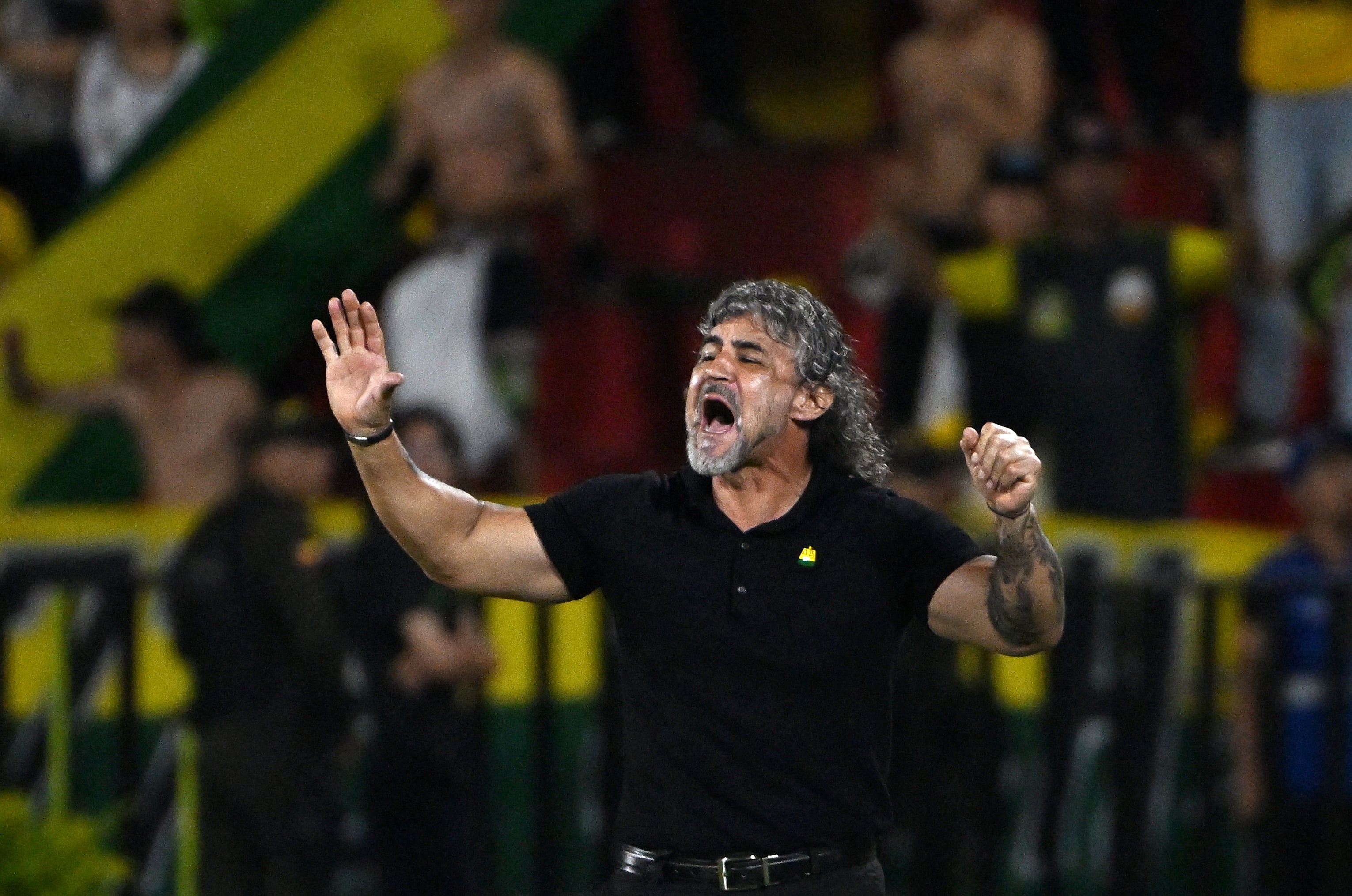 Bucaramanga's head coach Leonel Alvarez gestures during the Copa Libertadores group stage first round football match between Colombia's Atletico Bucaramanga and Chile's Colo Colo at the Americo Montanini stadium in Bucaramanga, Colombia, on April 1, 2025. (Photo by Luis ACOSTA / AFP)