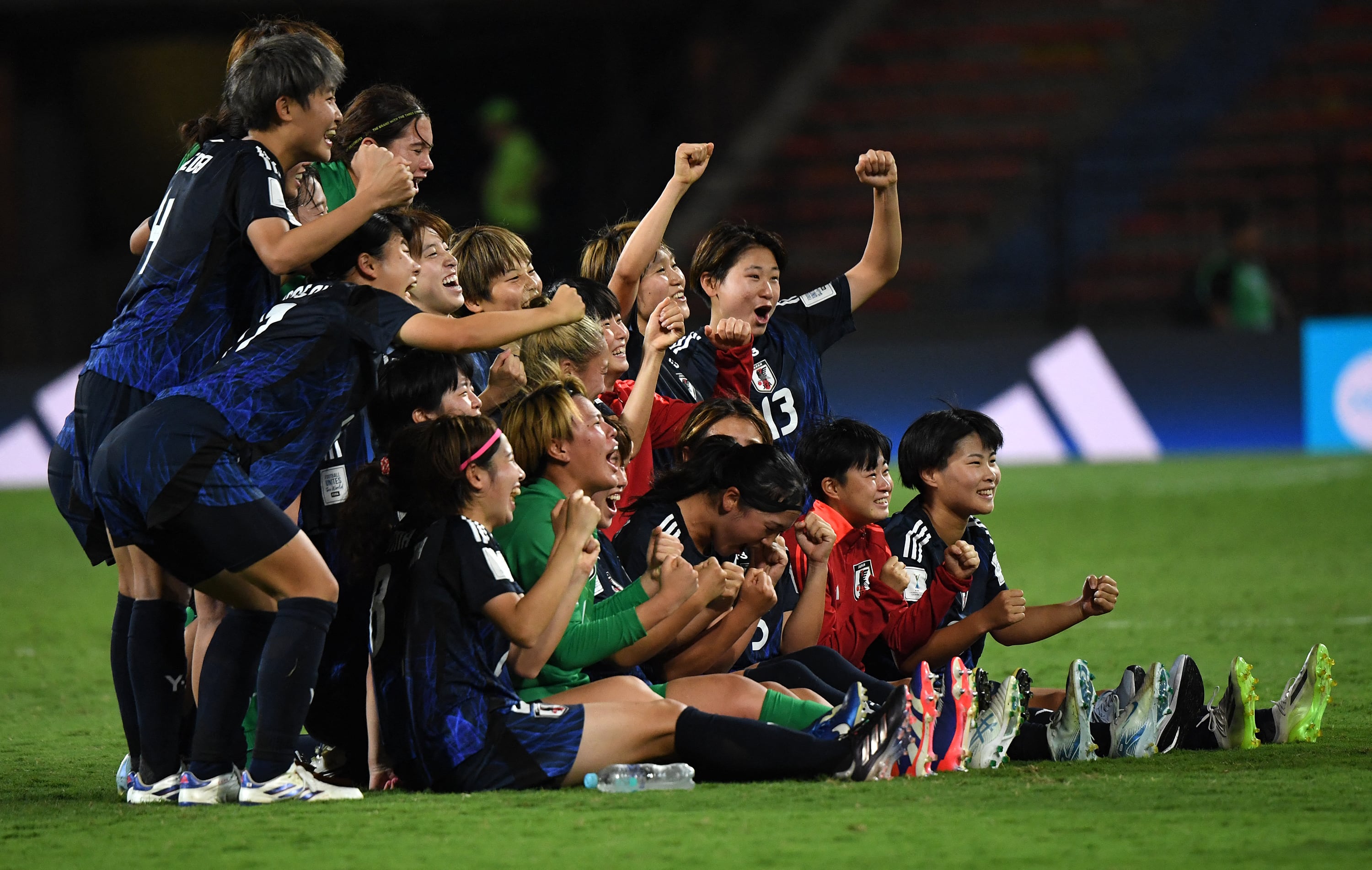 Japan players celebrate after winning the 2024 FIFA U-20 Women's World Cup quarterfinal match between Japan and Spain at the Atanasio Girardot stadium in Medellin, Colombia, on September 15, 2024. (Photo by JAIME SALDARRIAGA / AFP)
