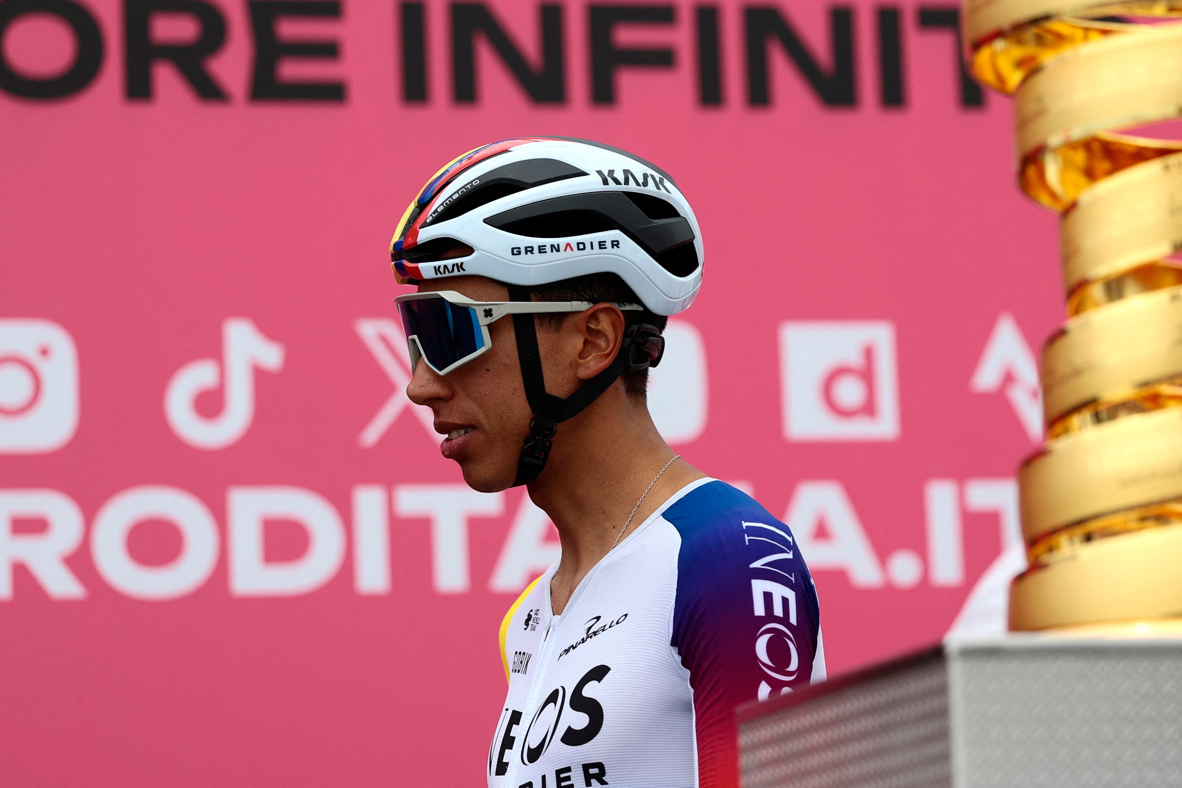 Ineos Grenadiers' Colombian rider Egan Bernal walks past the Giro d'Italia trophy (�trofeo senza fine�) prior to the first stage of the 108th Giro d'Italia cycling race, 160km from Durres to Tirana in Albania, on May 9, 2025. (Photo by Luca Bettini / AFP)