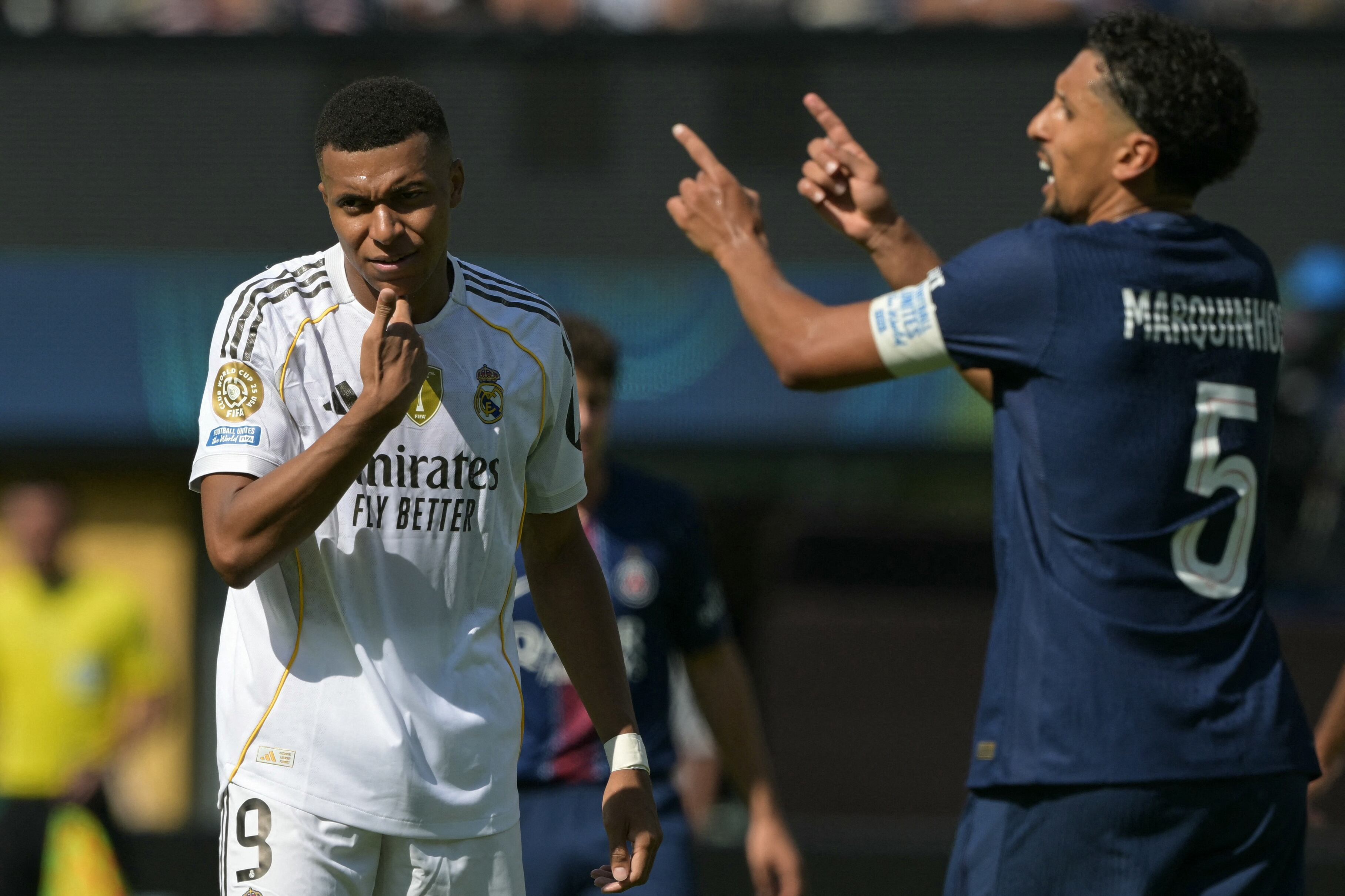 Real Madrid's French forward #09 Kylian Mbappe (L) reacts past Paris Saint-Germain's Brazilian defender #05 Marquinhos (R) during the FIFA Club World Cup 2025 semifinal football match between France's Paris Saint-Germain and Spain's Real Madrid at the MetLife stadium in East Rutherford, New Jersey on July 9, 2025. (Photo by JUAN MABROMATA / AFP)
