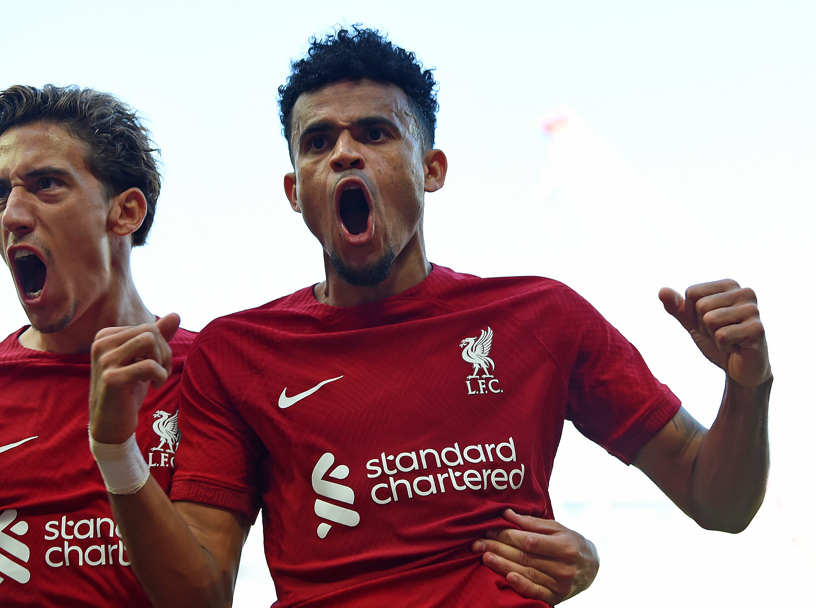 LIVERPOOL, ENGLAND - AUGUST 27: (THE SUN OUT. THE SUN ON SUNDAY OUT) Kostas Tsimikas of Liverpool with Luis Diaz of Liverpool after Luis Diaz scored the 9th goal during the Premier League match between Liverpool FC and AFC Bournemouth at Anfield on August 27, 2022 in Liverpool, England. (Photo by John Powell/Liverpool FC via Getty Images)