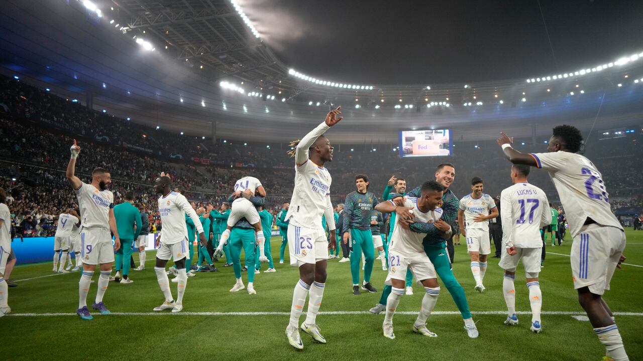 Real Madrid players celebrate winning the Champions League final soccer match between Liverpool and Real Madrid at the Stade de France in Saint Denis near Paris, Saturday, May 28, 2022. Real Madrid won 1-0. (AP Photo/Kirsty Wigglesworth)
