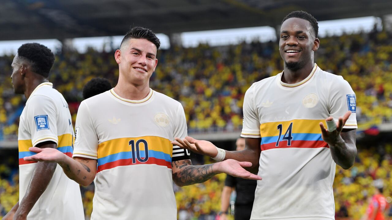 BARRANQUILLA, COLOMBIA - OCTOBER 15: Jhon Duran of Colombia (R) celebrates with teammate James Rodriguez after scoring the team's third goal during the FIFA World Cup 2026 South American Qualifier match between Colombia and Chile at Roberto Melendez Metropolitan Stadium on October 15, 2024 in Barranquilla, Colombia. (Photo by Gabriel Aponte/Getty Images)