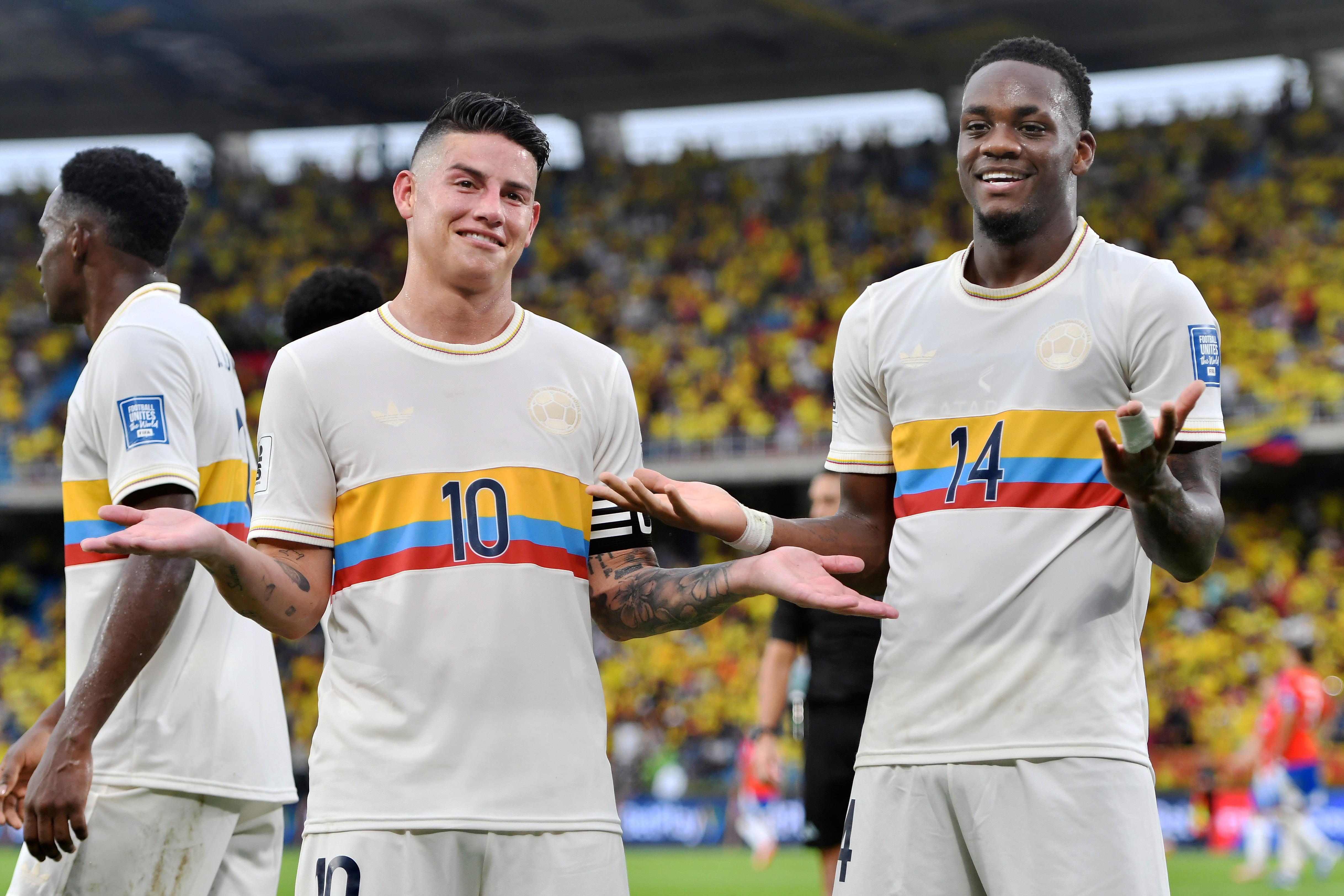 BARRANQUILLA, COLOMBIA - OCTOBER 15: Jhon Duran of Colombia (R) celebrates with teammate James Rodriguez after scoring the team's third goal during the FIFA World Cup 2026 South American Qualifier match between Colombia and Chile at Roberto Melendez Metropolitan Stadium on October 15, 2024 in Barranquilla, Colombia. (Photo by Gabriel Aponte/Getty Images)
