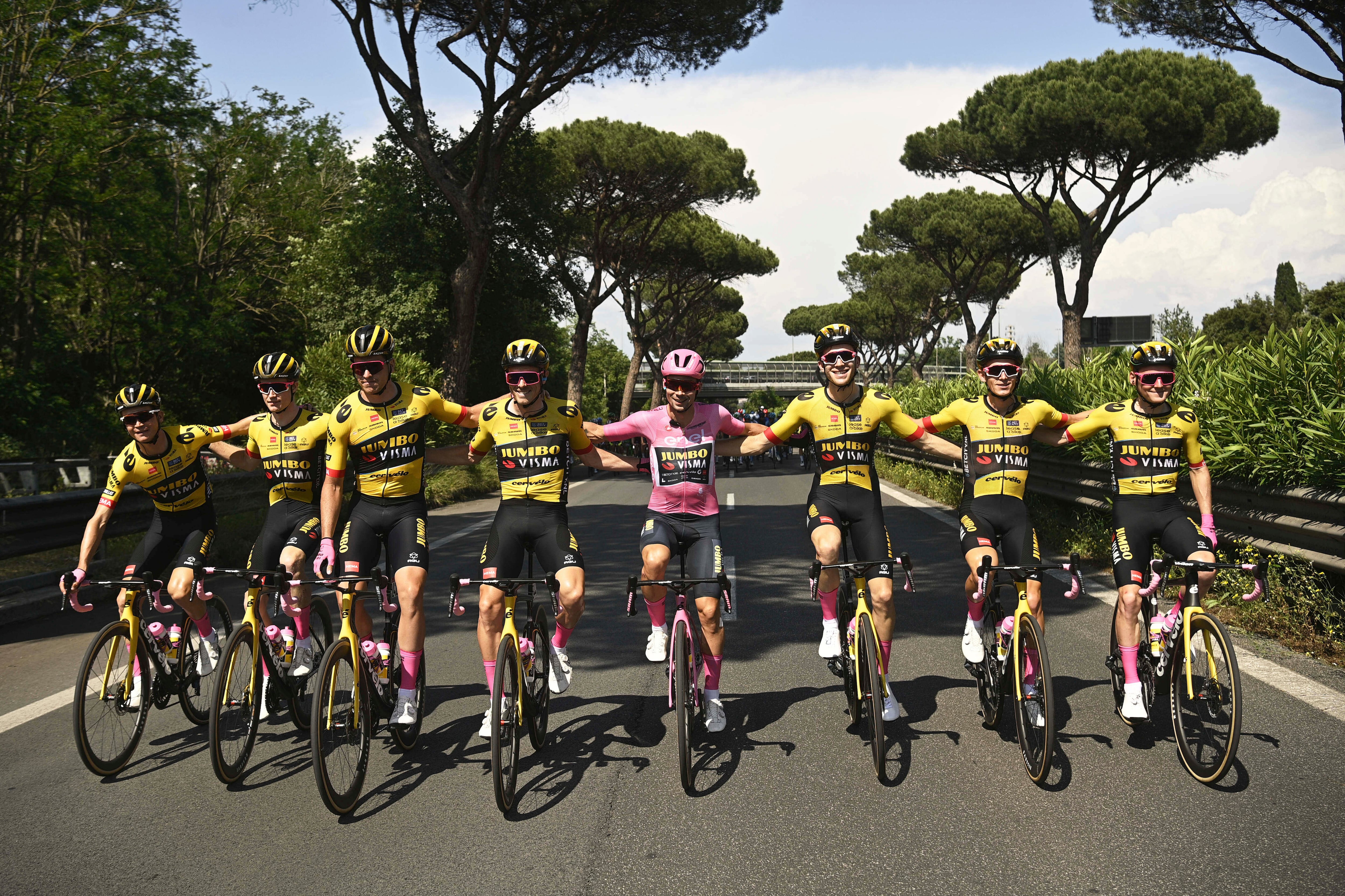 Wearing the pink jersey of the race overall leader Slovenia's Primoz Roglic, center, pedals alongside his Jumbo-Visma teammates during the last stage of the Giro d'Italia cycling race, in Rome, Sunday, May 28, 2023. Primoz Roglic is all but assured to be crowned Giro d’Italia champion as the Slovenian takes a 14-second lead over Geraint Thomas into the mostly ceremonious final stage, a 135-kilometer (84-mile) leg through the cobblestoned streets of the capital that concludes next to the Roman Forum. (Fabio Ferrari/LaPresse via AP)