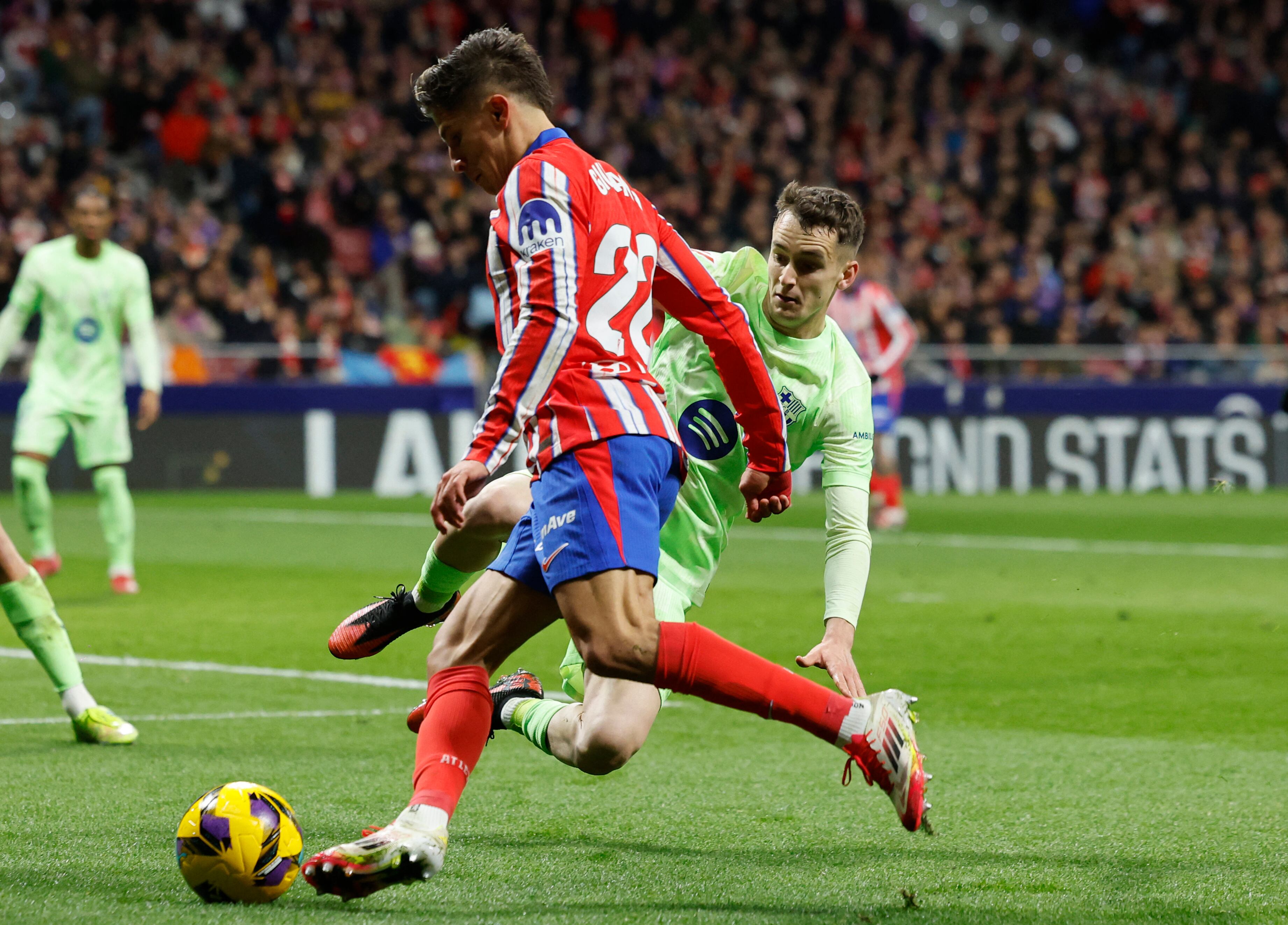 Barcelona's Spanish midfielder #17 Marc Casado fights for the ball with Atletico Madrid's Argentine forward #22 Giuliano Simeone during the Spanish league footbal match between Club Atletico de Madrid and FC Barcelona at Metropolitano Stadium in Madrid, on March 16, 2025. (Photo by OSCAR DEL POZO / AFP)
