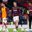 Manchester United's Bruno Fernandes, Cristiano Ronaldo and Marcus Rashford warm up on the pitch ahead of the Premier League match at Old Trafford, Manchester. Picture date: Thursday April 28, 2022. (Photo by Martin Rickett/PA Images via Getty Images)