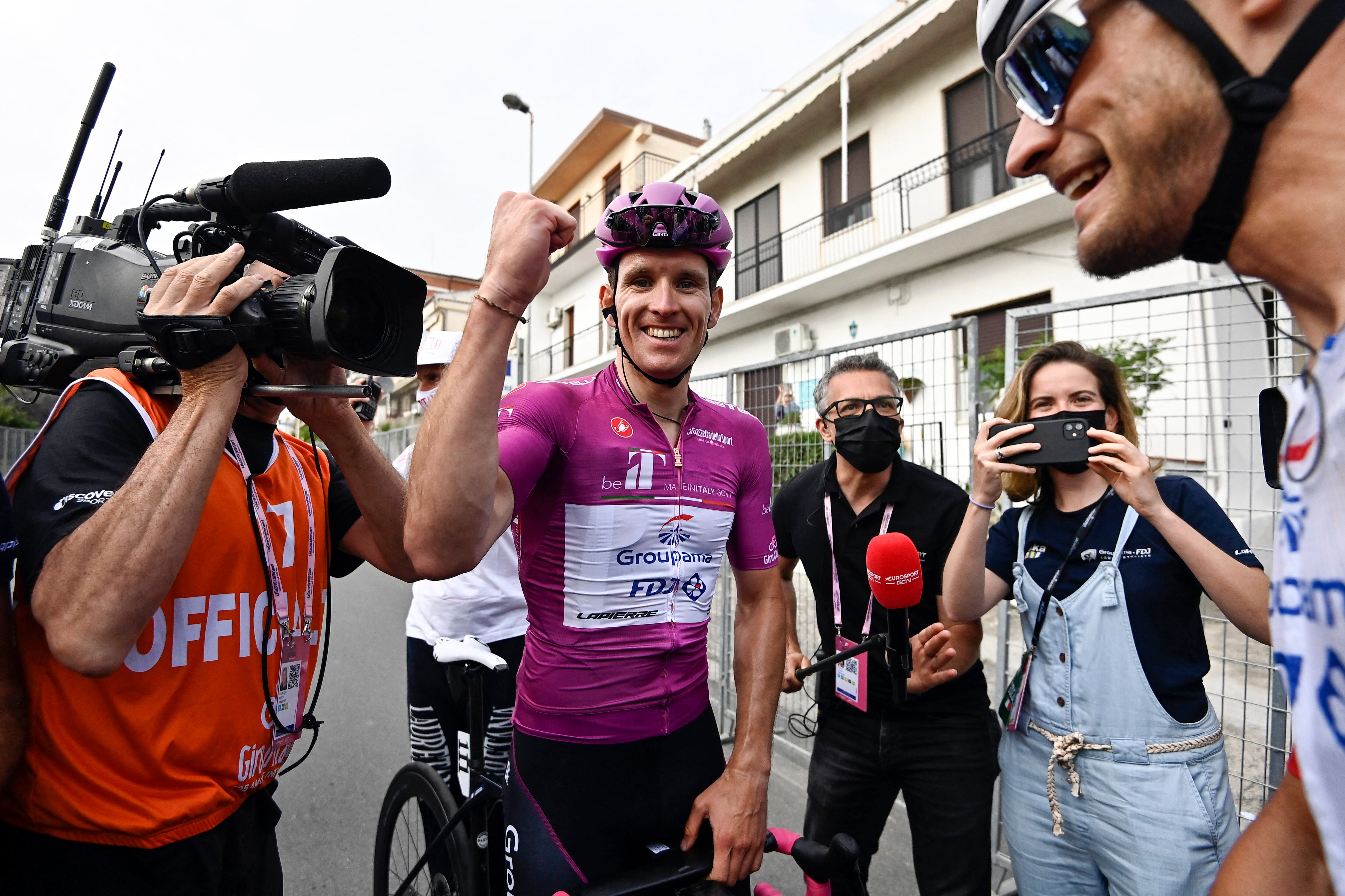 Team Groupama-FDJ's French rider Arnaud Demare celebrates with his team after winning the 6th stage of the Giro d'Italia 2022 cycling race, 192 kilometers between Palmi and Scalea, Calabria, on May 12, 2022. (Photo by Fabio FERRARI / POOL / AFP)